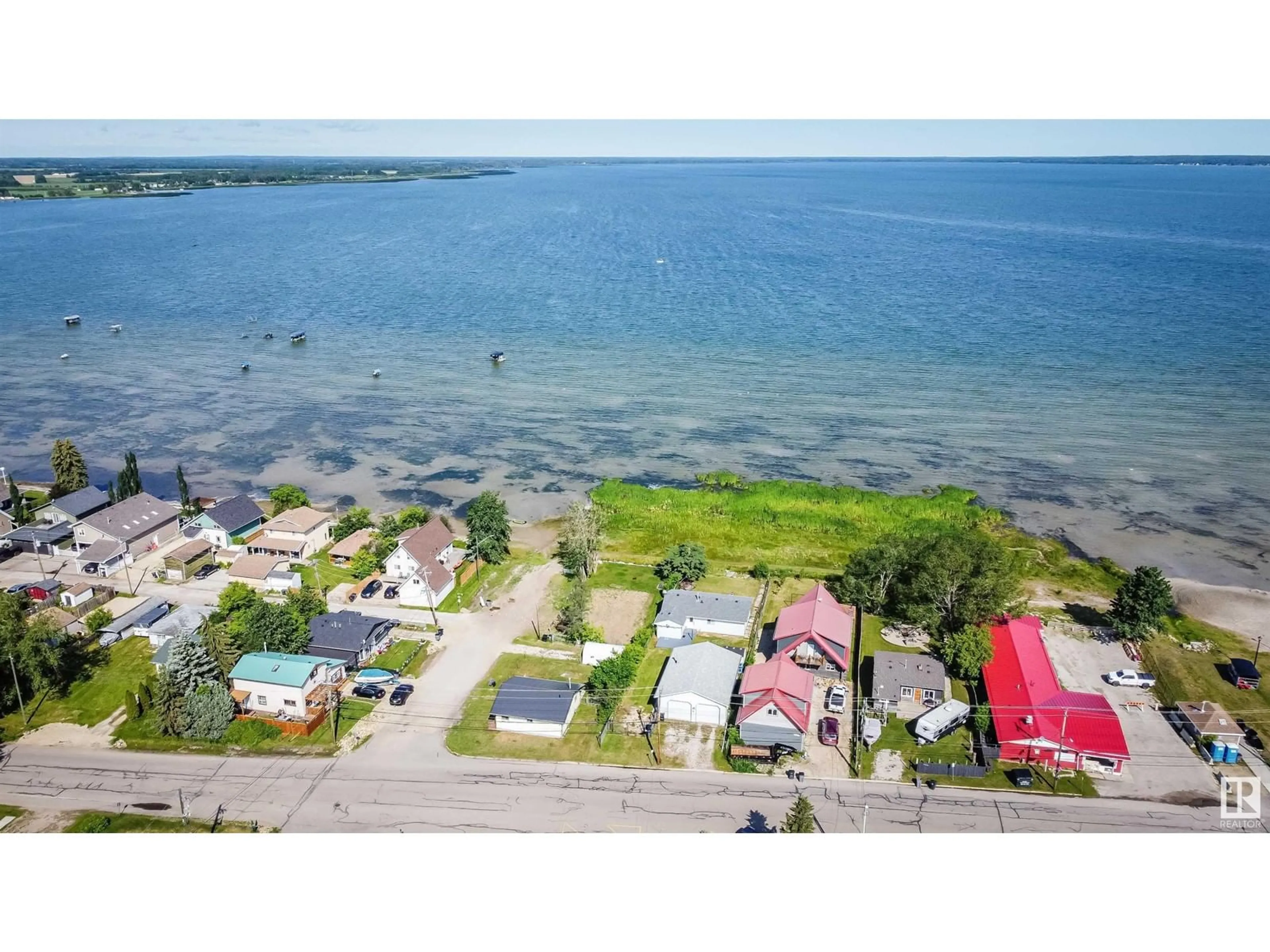 A pic from outside/outdoor area/front of a property/back of a property/a pic from drone, water/lake/river/ocean view for 5036 50 AV, Rural Lac Ste. Anne County Alberta T0E0A0