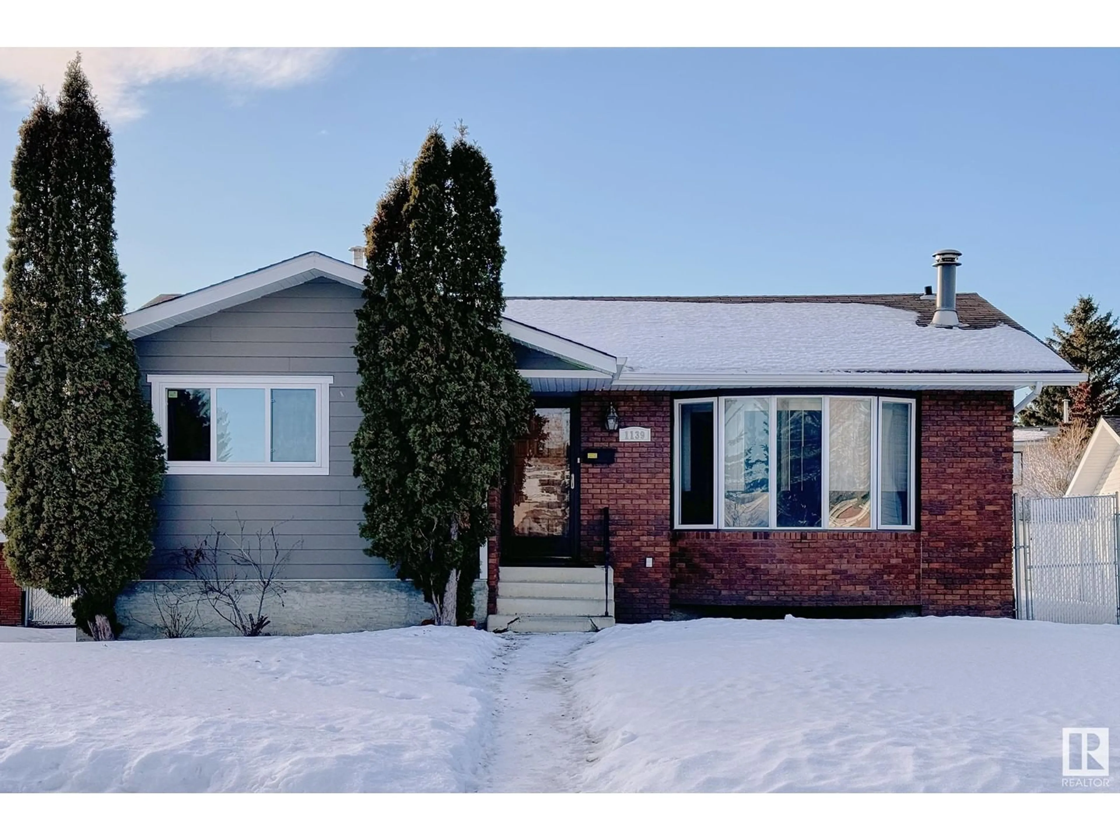 Home with brick exterior material, street for 1139 Lakewood Road North NW, Edmonton Alberta T6K3A9