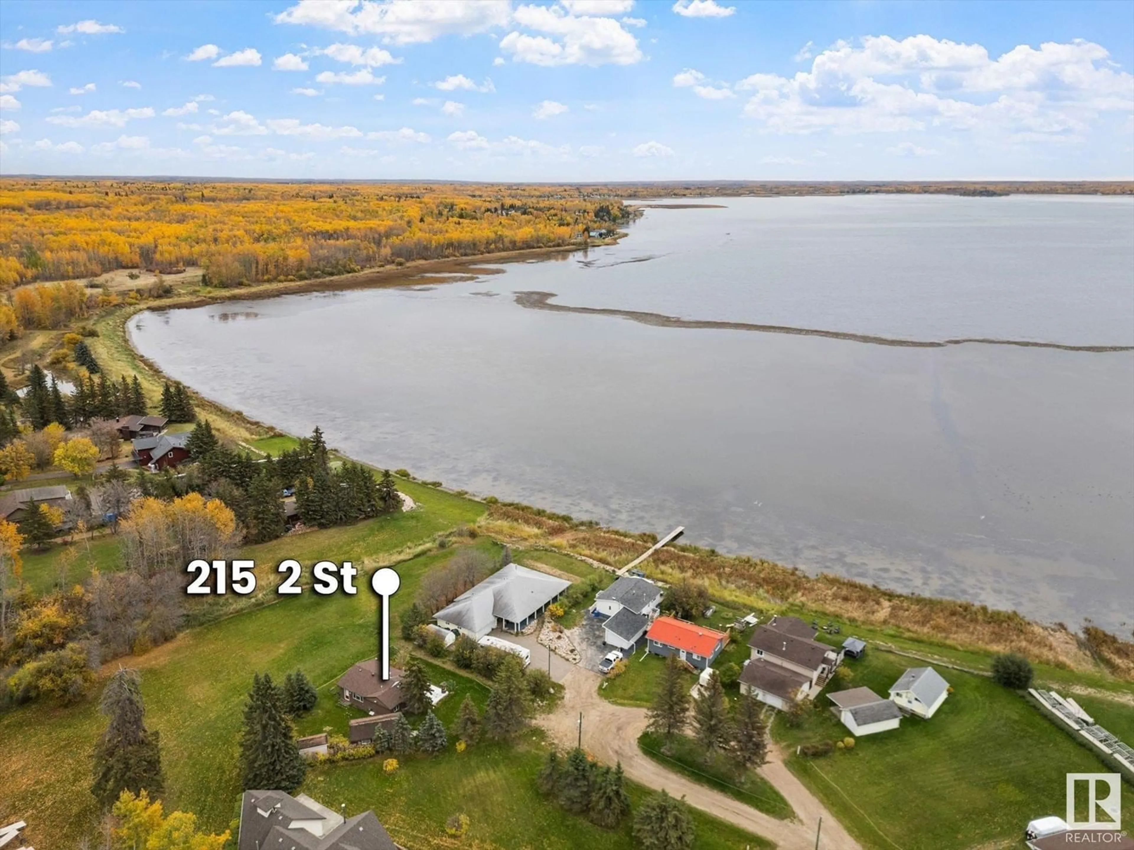 A pic from outside/outdoor area/front of a property/back of a property/a pic from drone, water/lake/river/ocean view for 215 2nd Street, Rural Lac Ste. Anne County Alberta T0E1A0