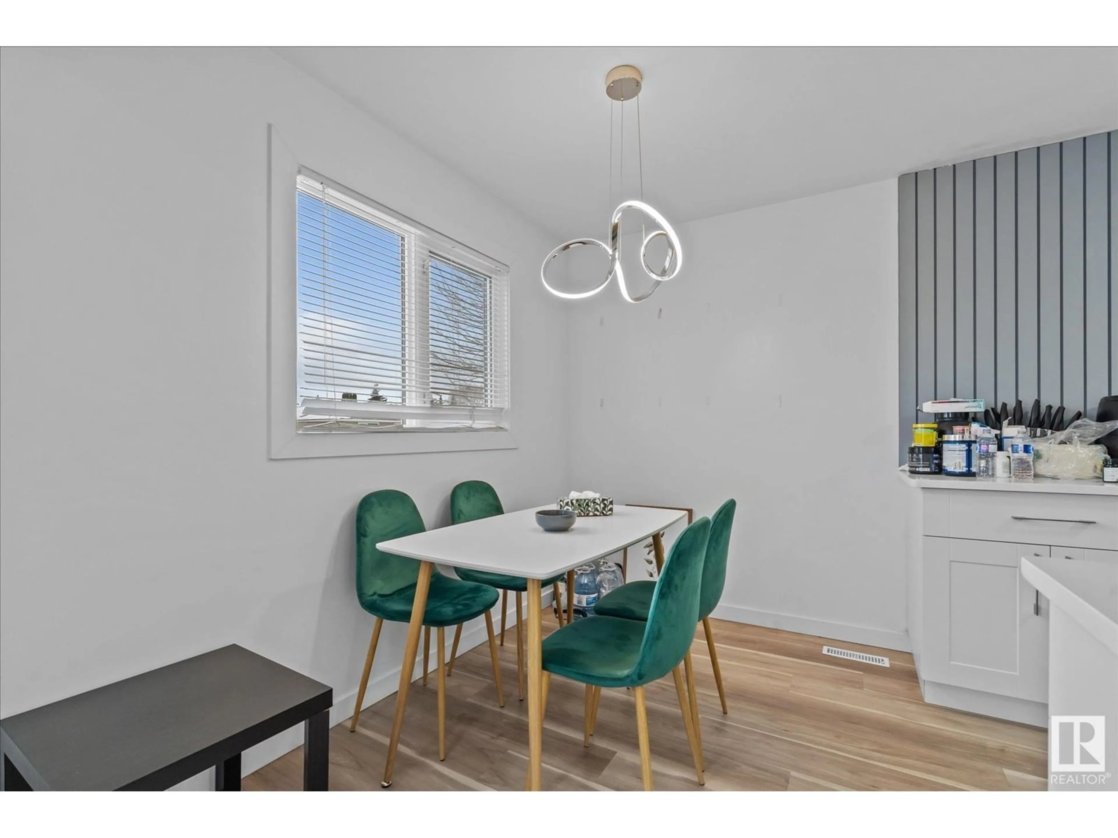 Dining room, wood/laminate floor for 11912 140 AV NW, Edmonton Alberta T5X5K1