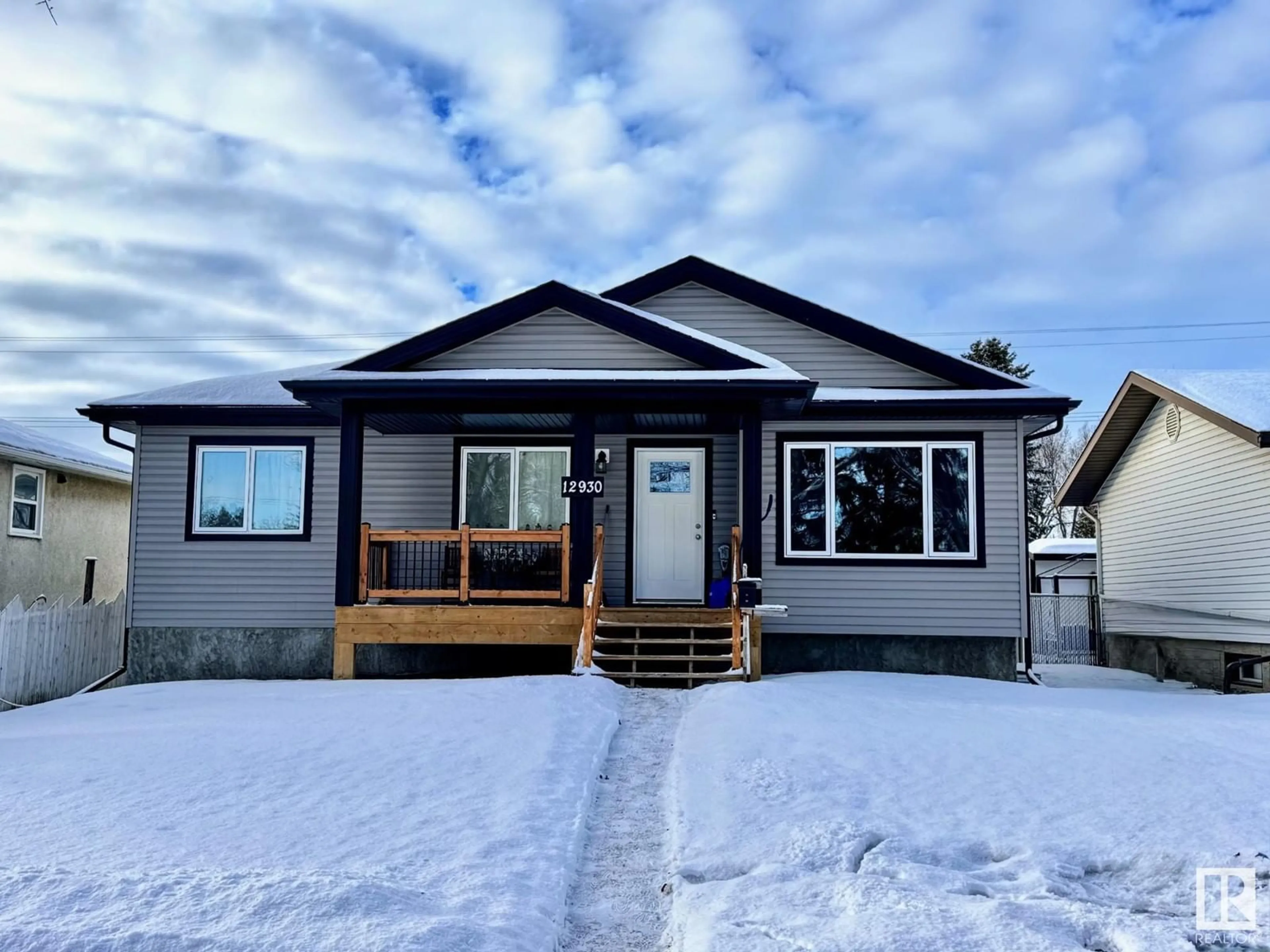 Home with vinyl exterior material, street for 12930 124 ST NW, Edmonton Alberta T5L0P5