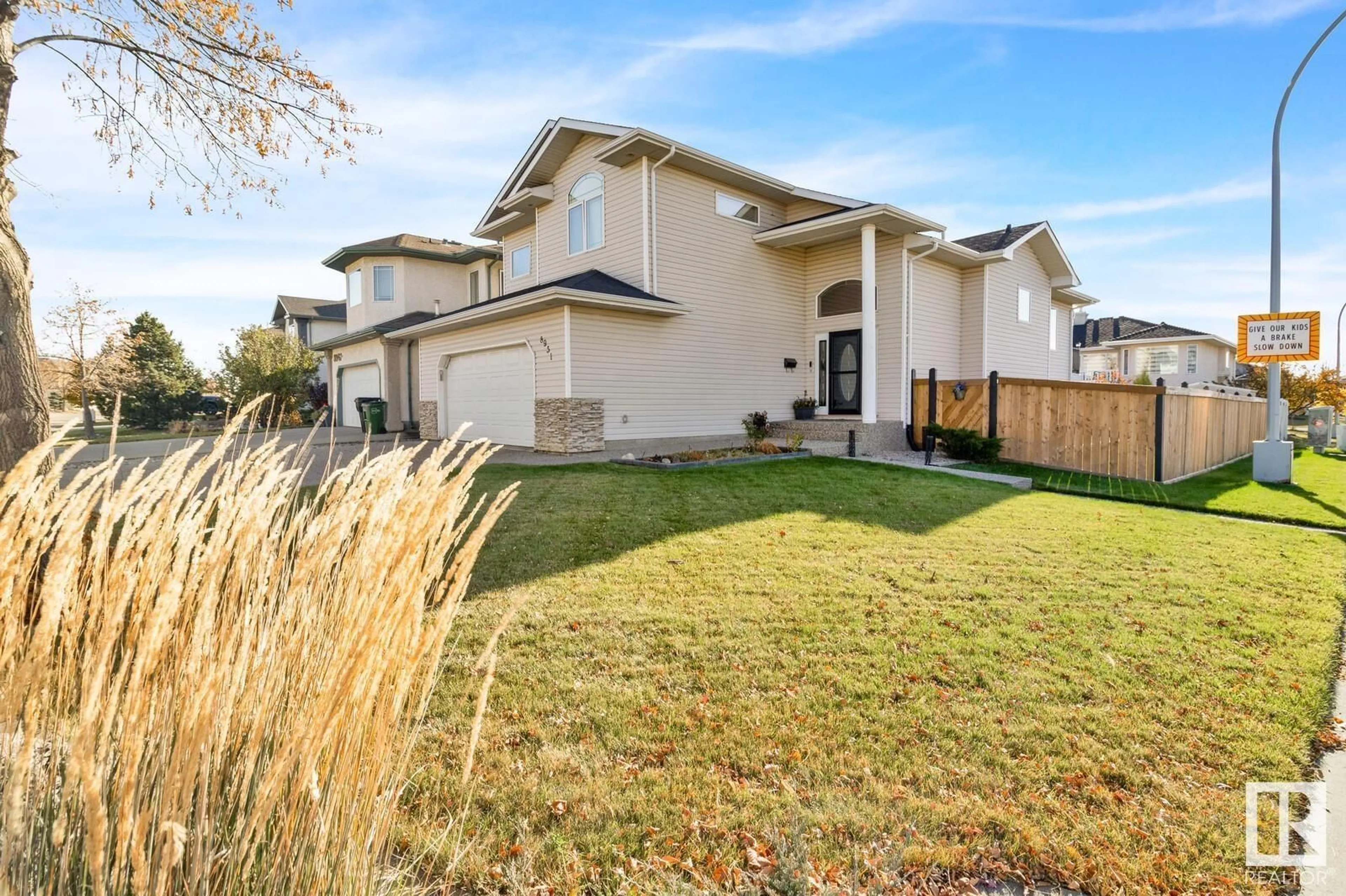 Home with vinyl exterior material, street for 8951 160 AV NW, Edmonton Alberta T5Z3J2