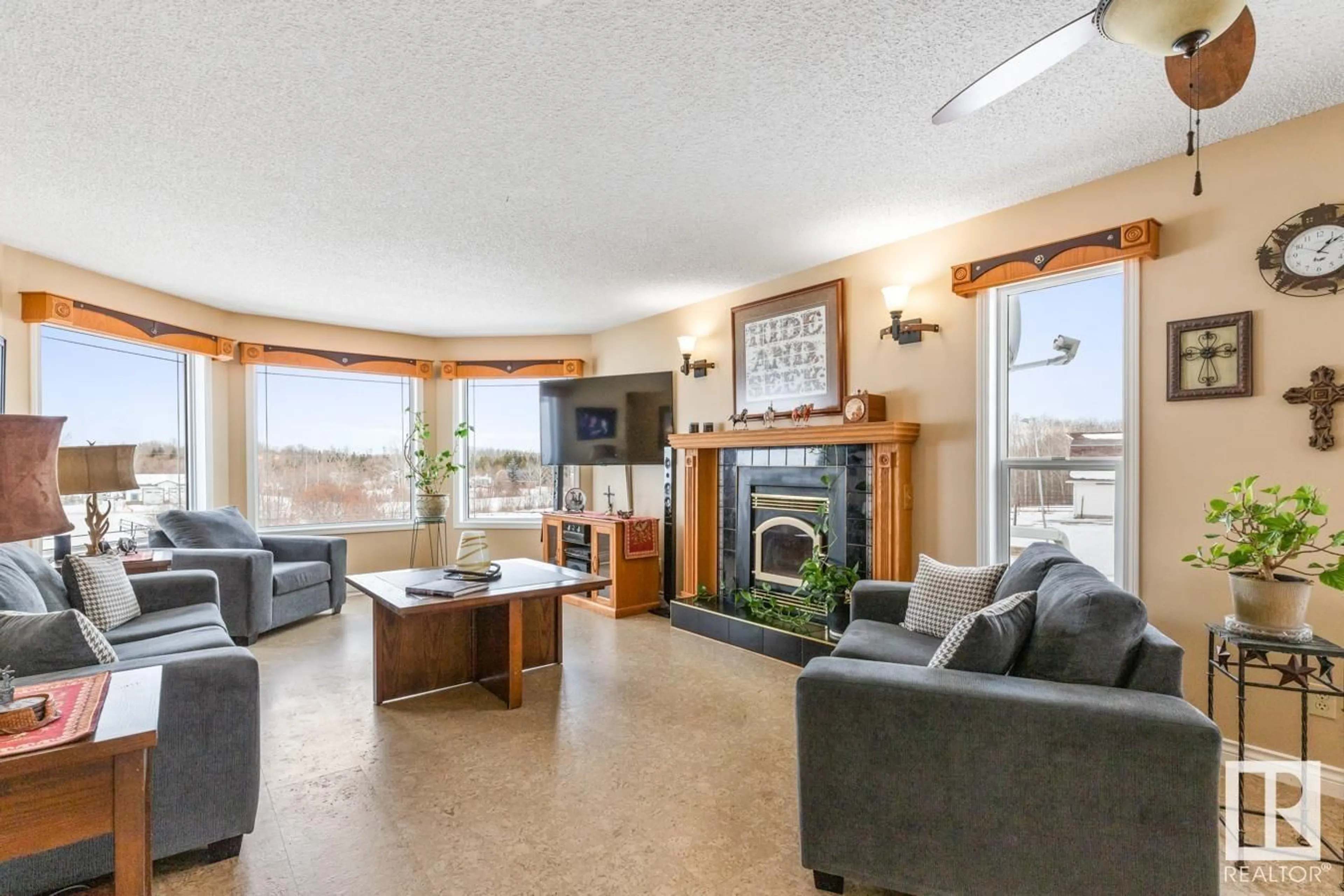 Living room with furniture, wood/laminate floor for #25 51047 RR 221, Rural Strathcona County Alberta T8E1G8