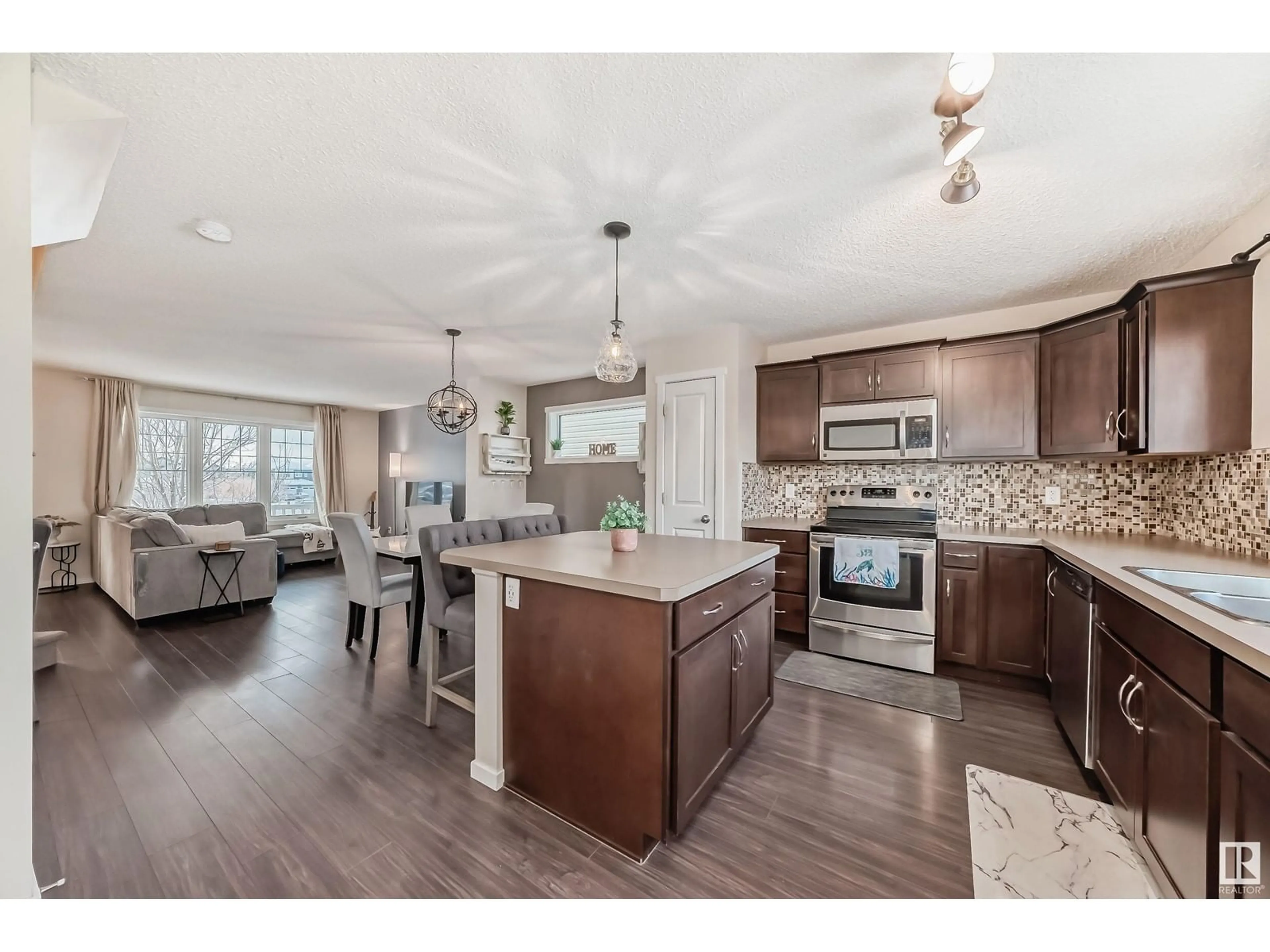 Open concept kitchen, wood/laminate floor for 2900 MAPLE WY NW, Edmonton Alberta T6T0T4