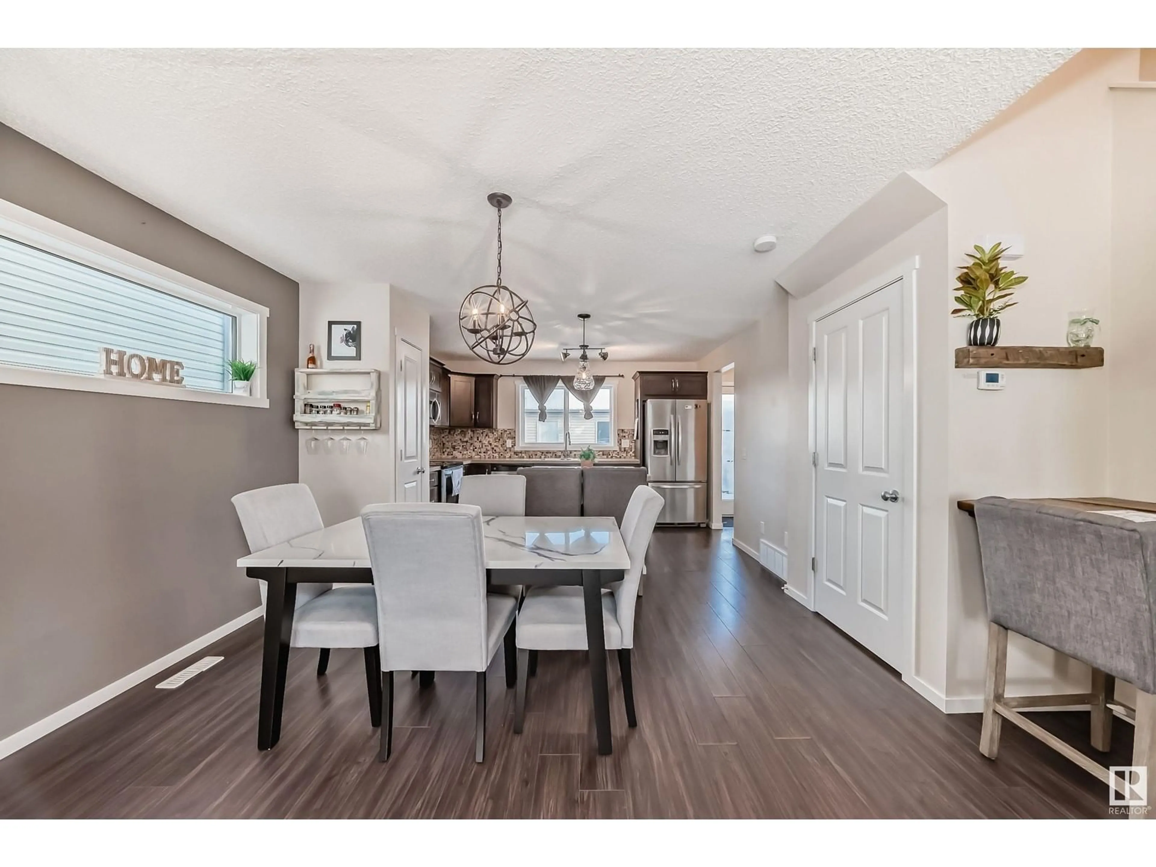 Open concept kitchen, wood/laminate floor for 2900 MAPLE WY NW, Edmonton Alberta T6T0T4