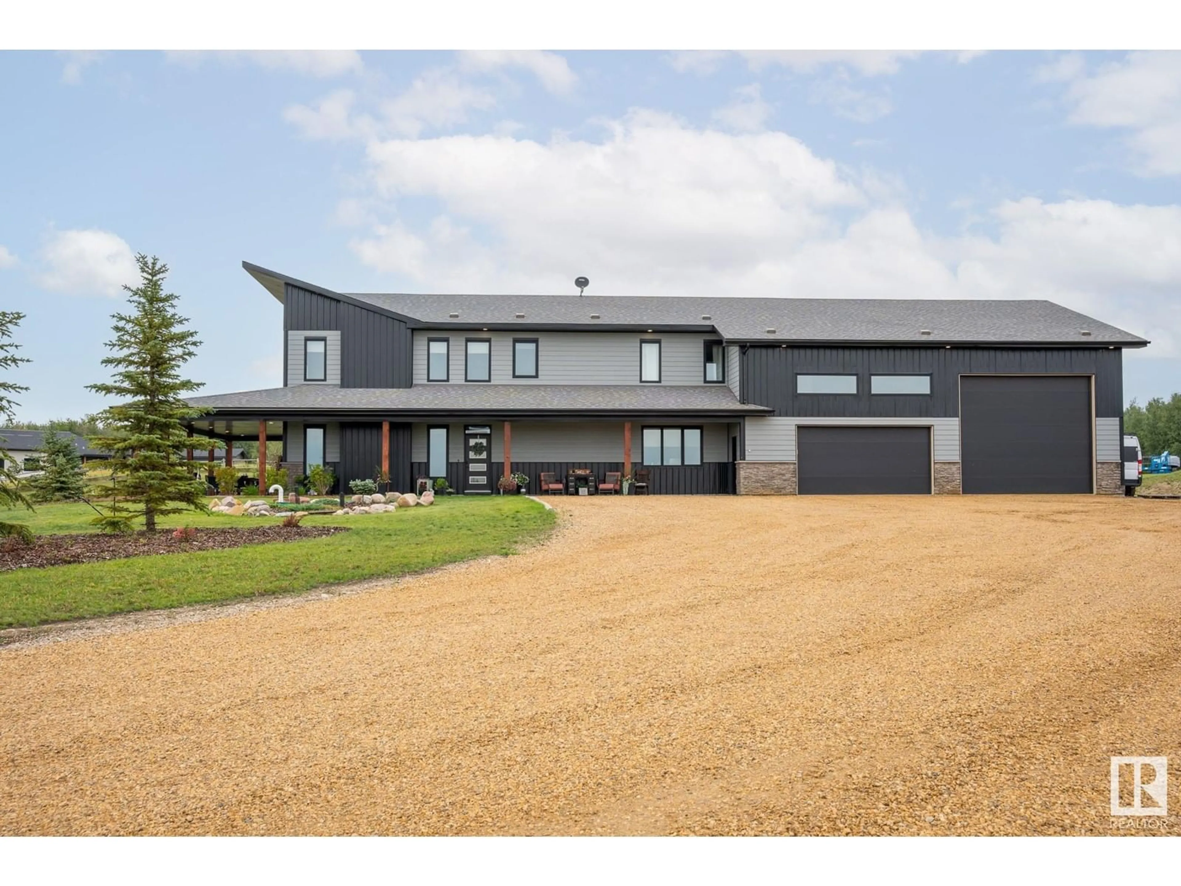 A pic from outside/outdoor area/front of a property/back of a property/a pic from drone, building for #54 53156 RGE RD 213, Rural Strathcona County Alberta T8G2C3