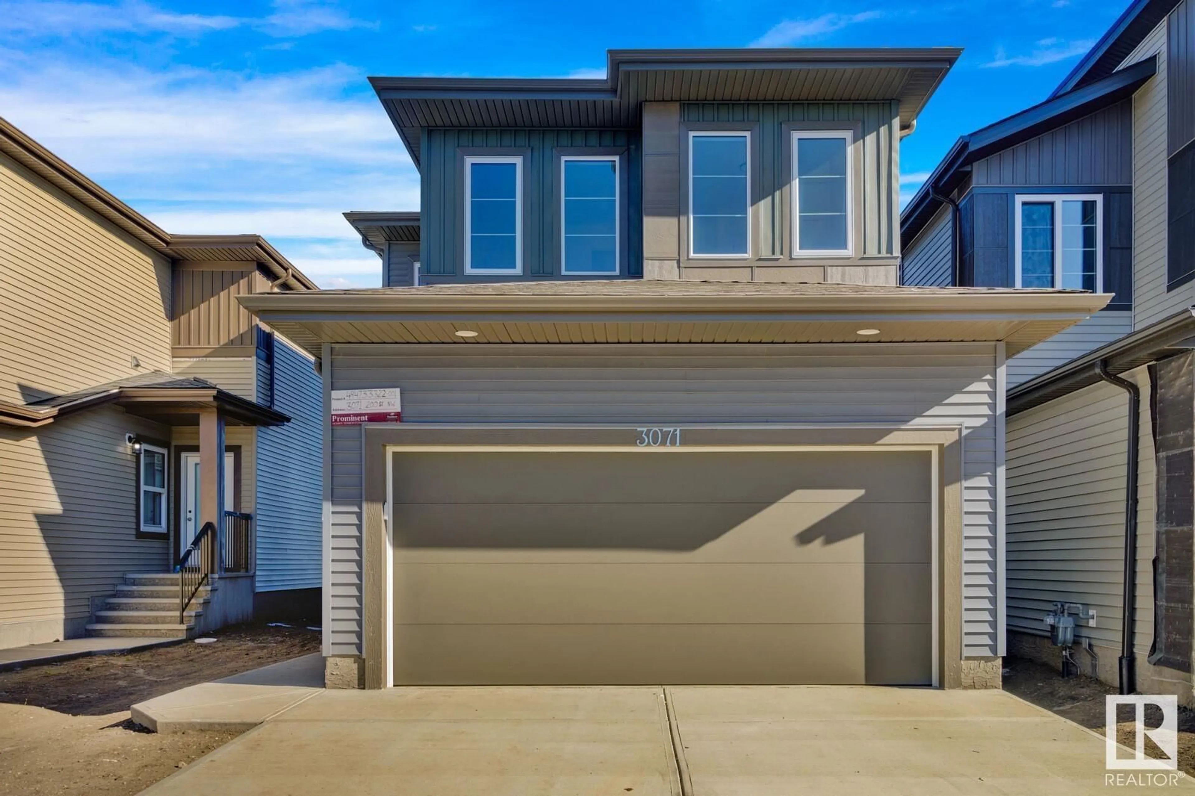 Home with vinyl exterior material, street for 3071 200 ST NW, Edmonton Alberta T6M1N7