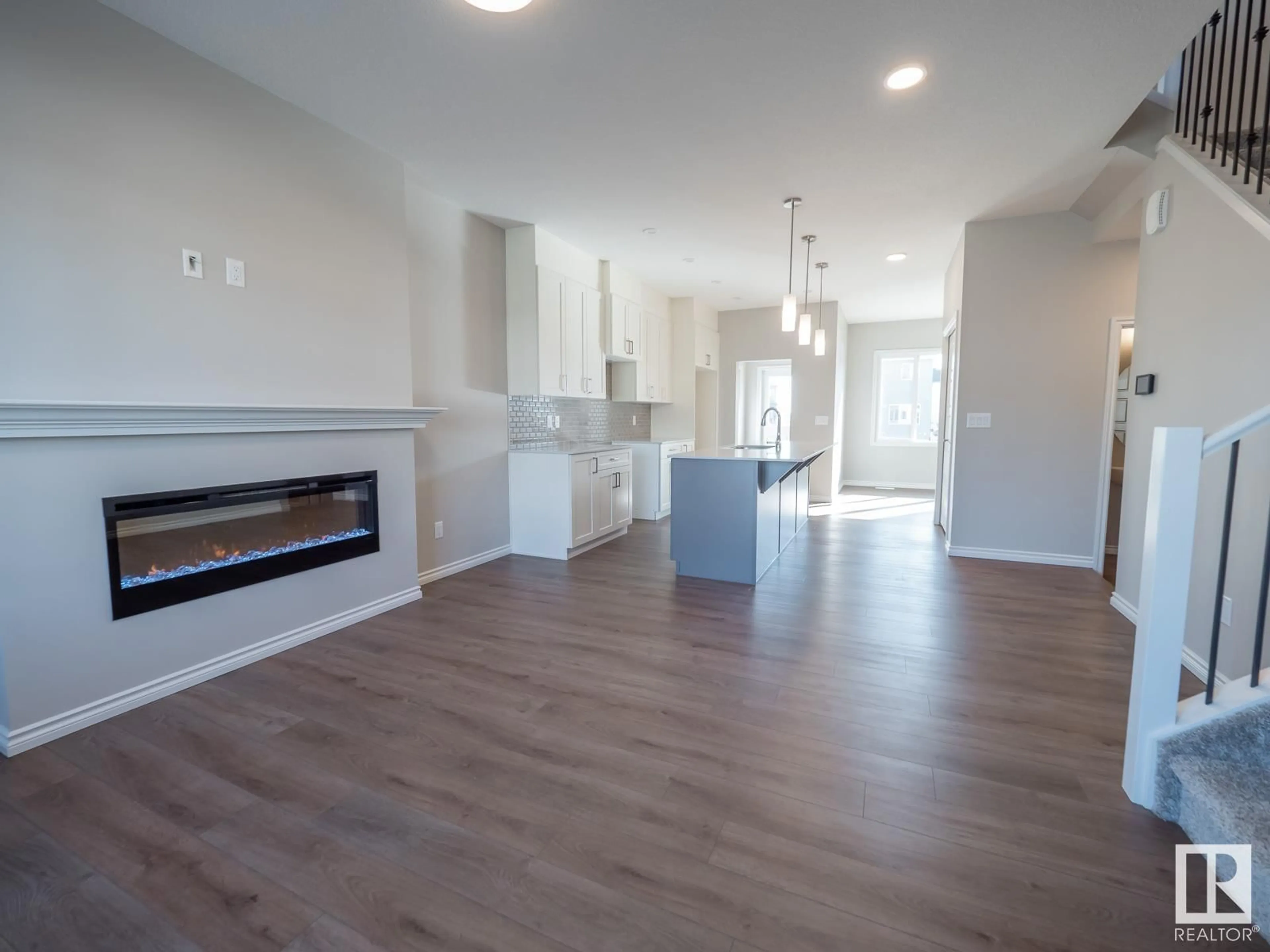 Open concept kitchen, wood/laminate floor for 1109 ASTER BV NW, Edmonton Alberta T6T2V2