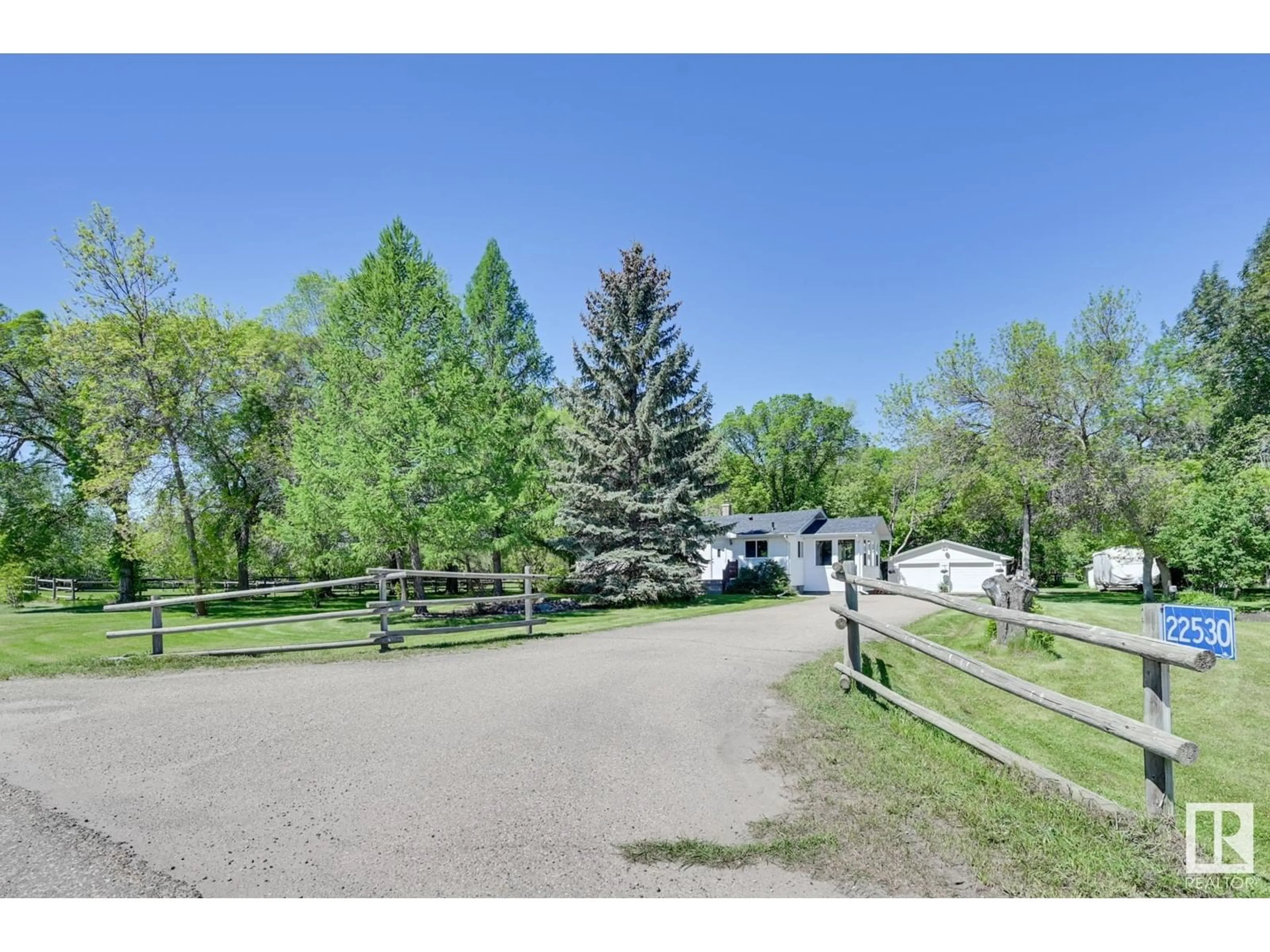 A pic from outside/outdoor area/front of a property/back of a property/a pic from drone, street for 22530 Lamoureux DR, Rural Sturgeon County Alberta T8L5A6