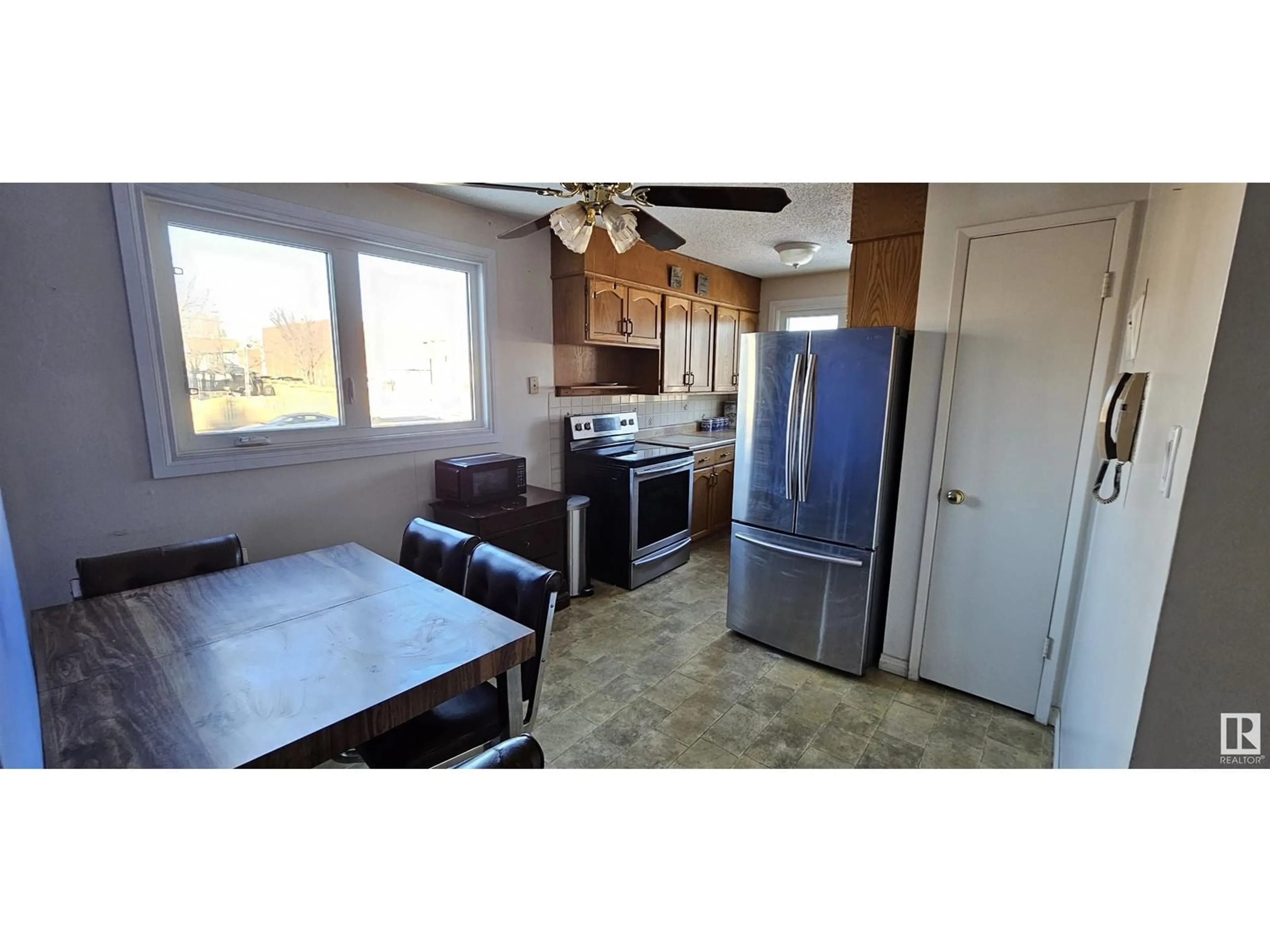 Open concept kitchen, ceramic/tile floor for #201 11045 132 ST NW, Edmonton Alberta T5M1E4