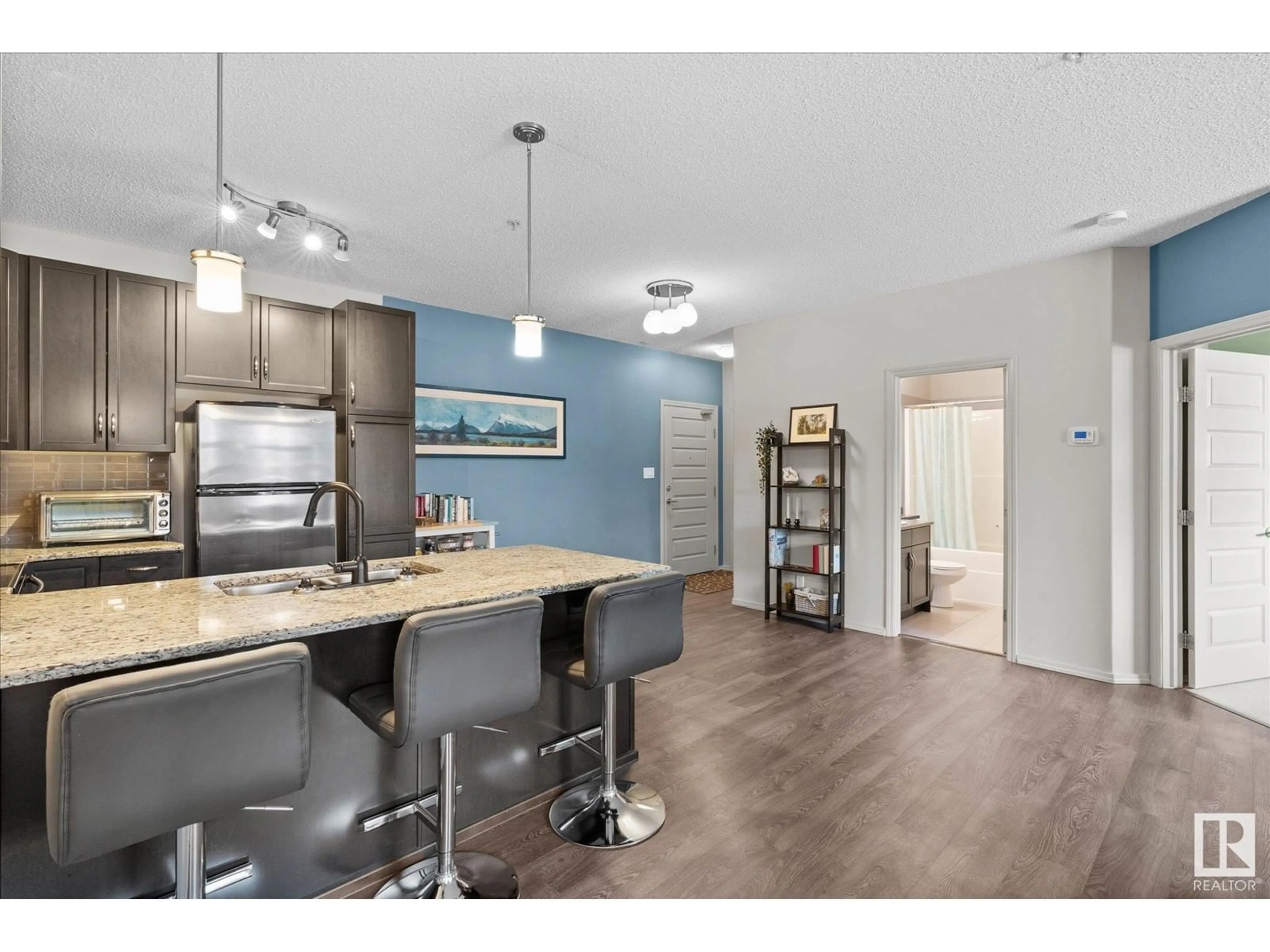 Open concept kitchen, wood/laminate floor for #235 7825 71 ST NW, Edmonton Alberta T6B3R9