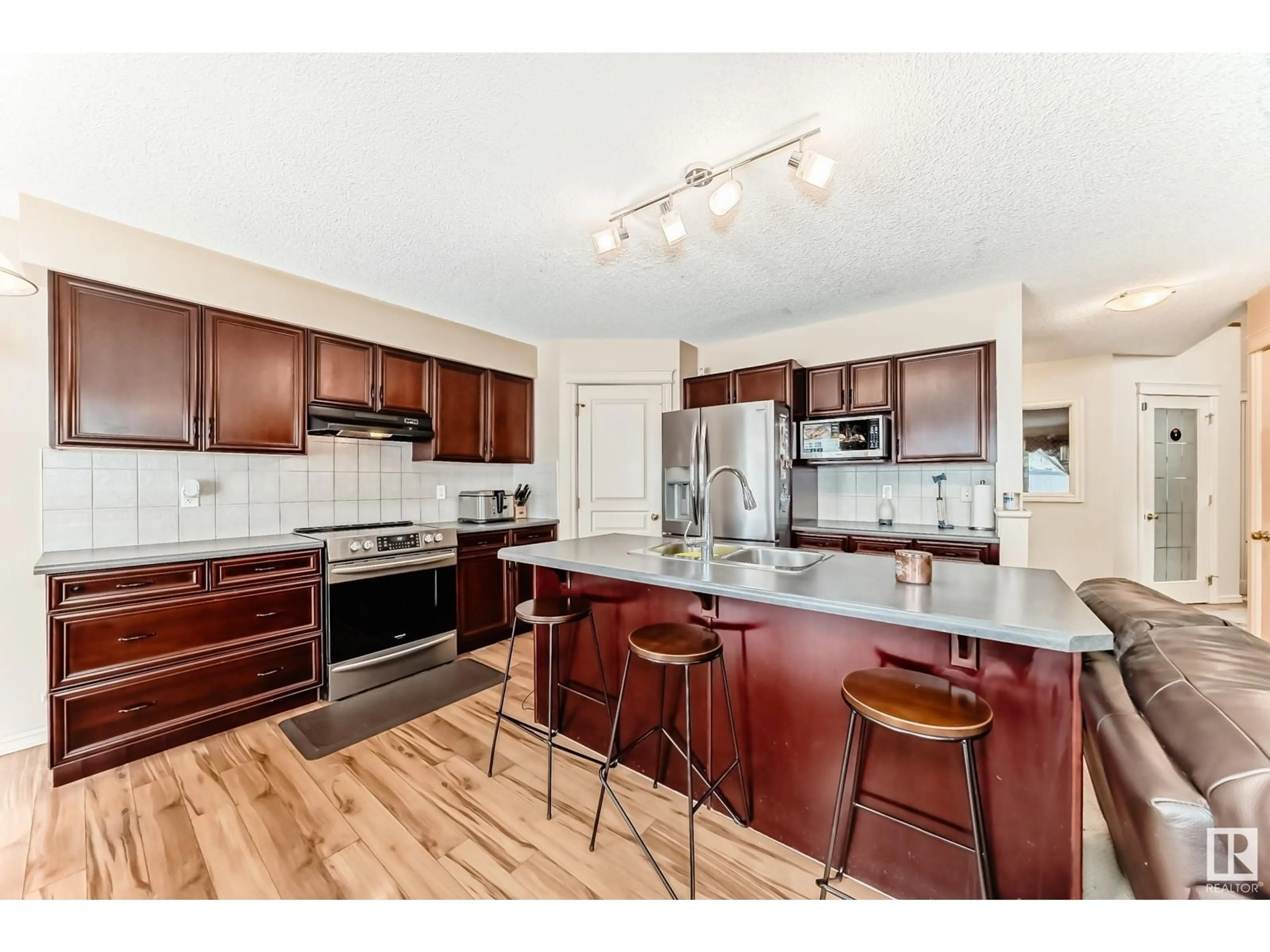 Open concept kitchen, unknown for 8728 10 AV SW, Edmonton Alberta T6X1J6