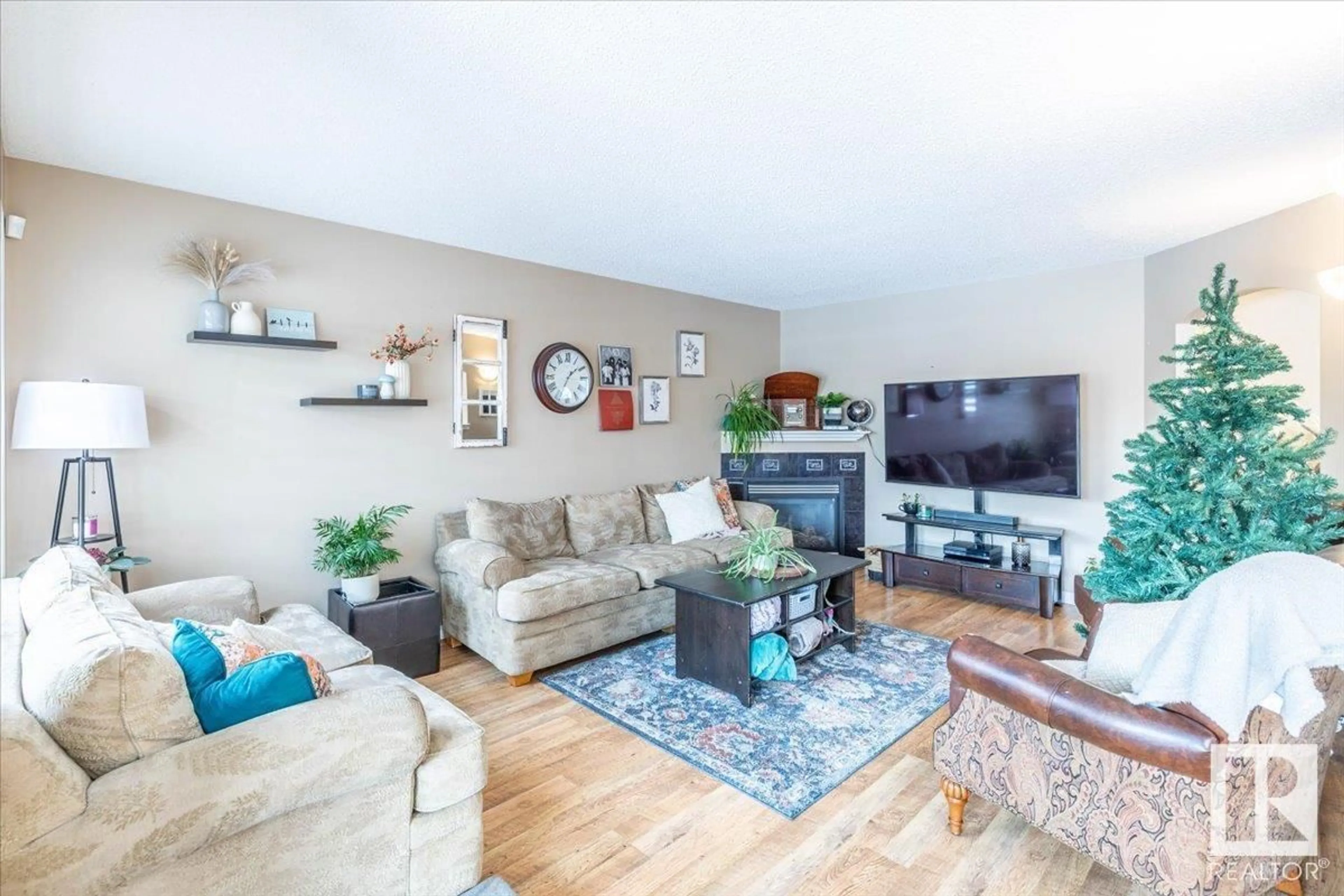 Living room with furniture, wood/laminate floor for 120 ACACIA CI, Leduc Alberta T9E0C9