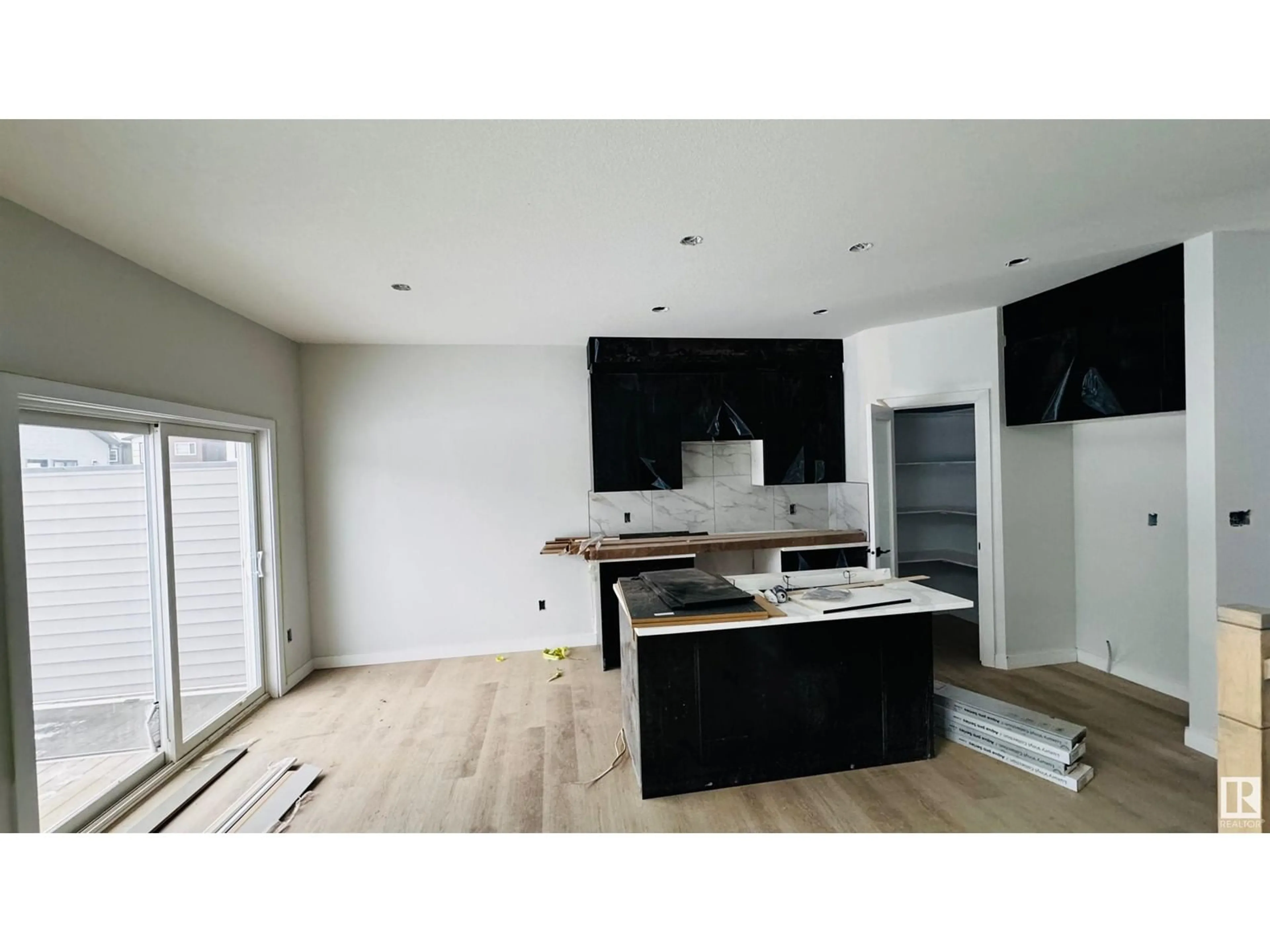 Open concept kitchen, wood/laminate floor for 8510 MAYDAY RU SW, Edmonton Alberta T6X3E9