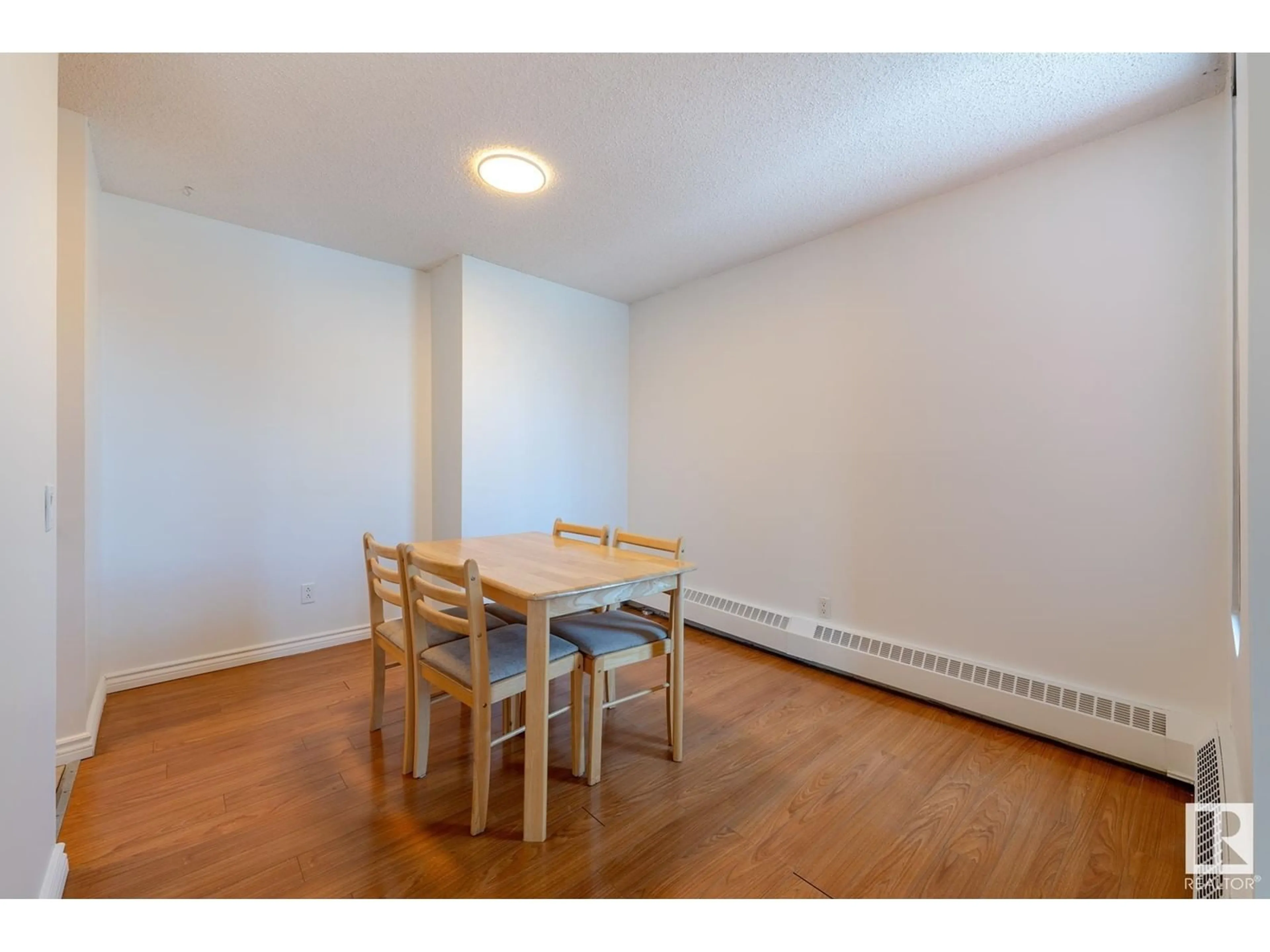 Dining room, wood/laminate floor for #701 10145 109 ST NW, Edmonton Alberta T5J3M5