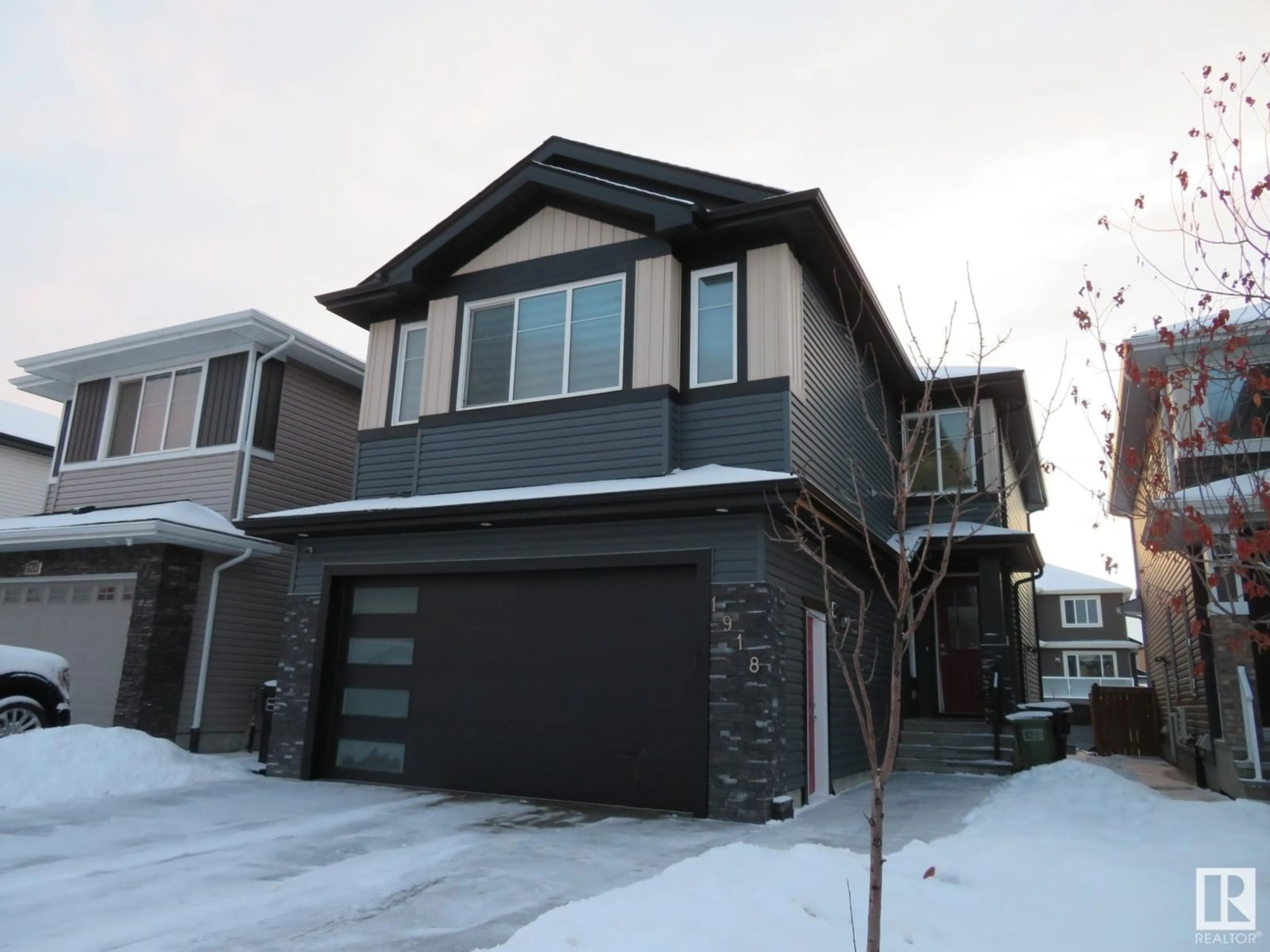 Home with vinyl exterior material, street for 1918 20 ST NW, Edmonton Alberta T6E2K9