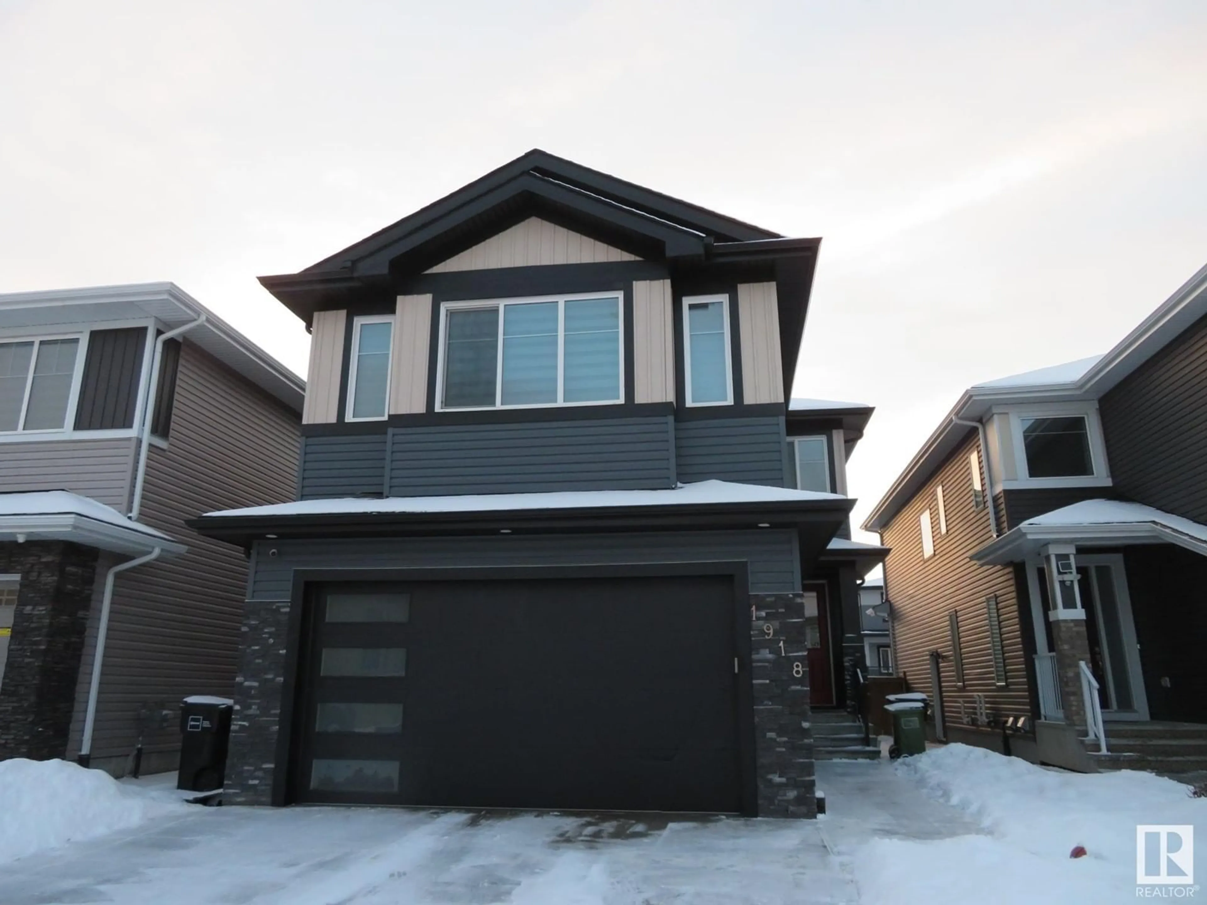 Home with vinyl exterior material, street for 1918 20 ST NW, Edmonton Alberta T6E2K9