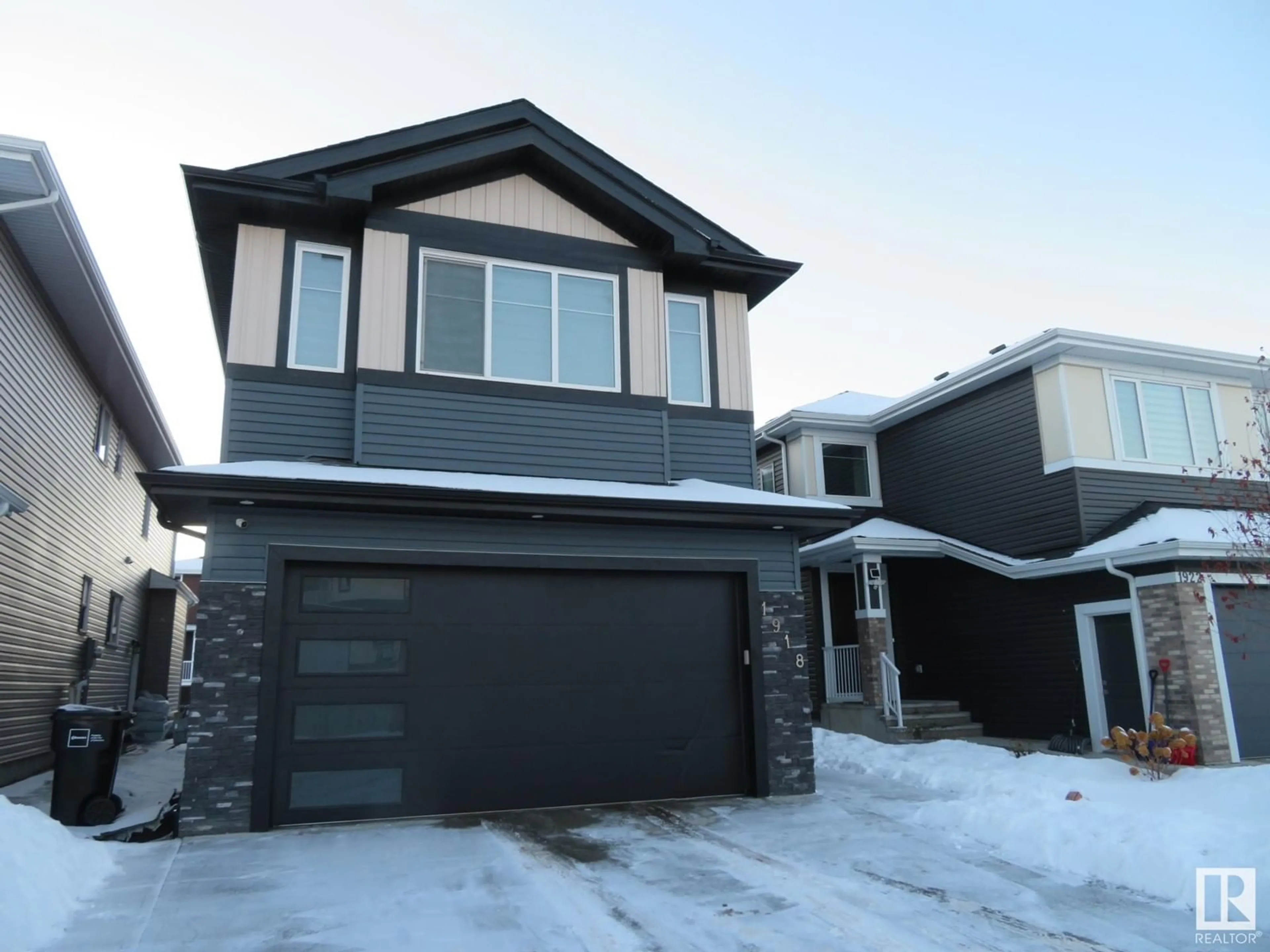 Home with vinyl exterior material, street for 1918 20 ST NW, Edmonton Alberta T6E2K9