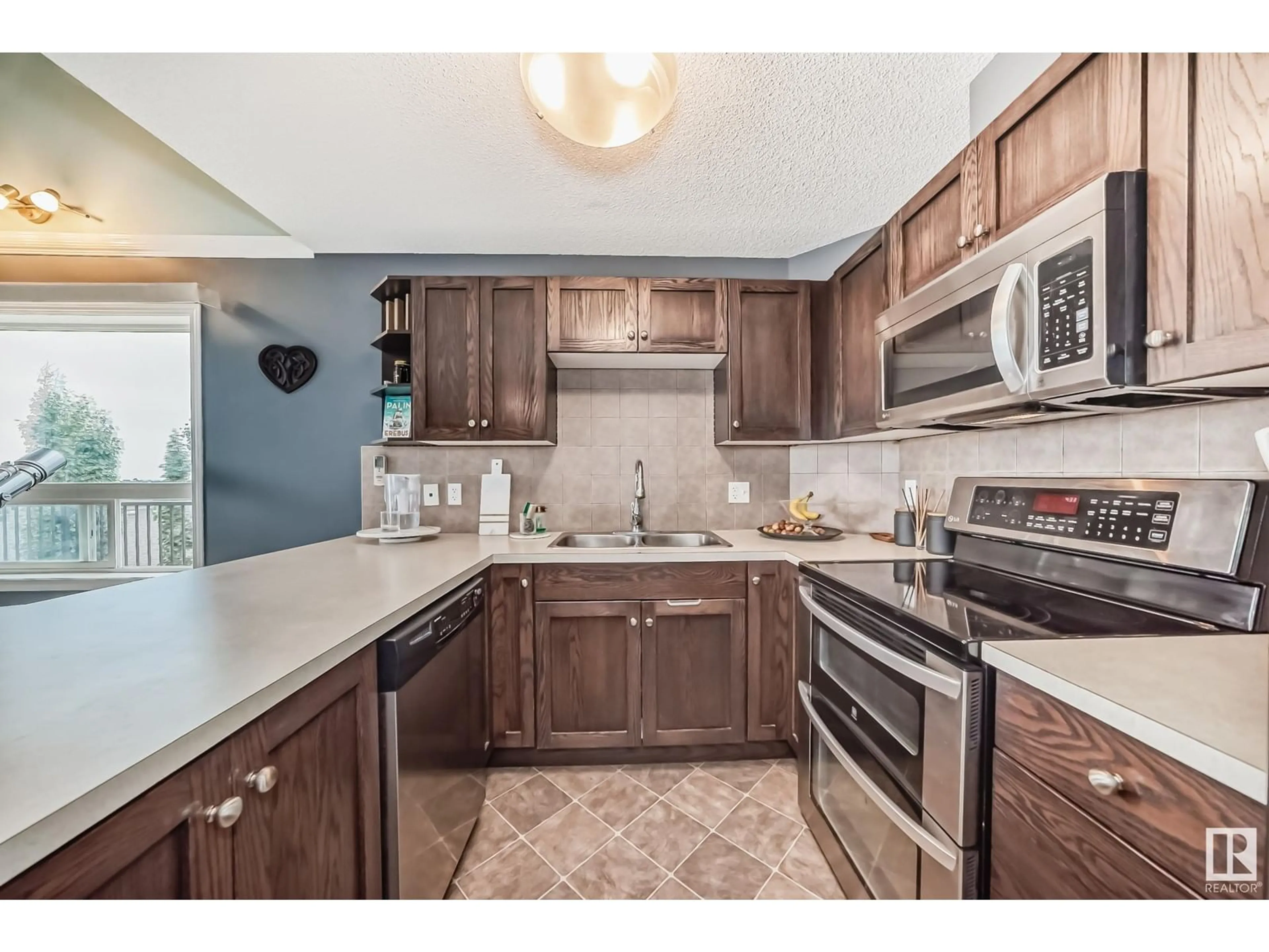 Standard kitchen, ceramic/tile floor for #426 1520 HAMMOND GA NW, Edmonton Alberta T6M0J4