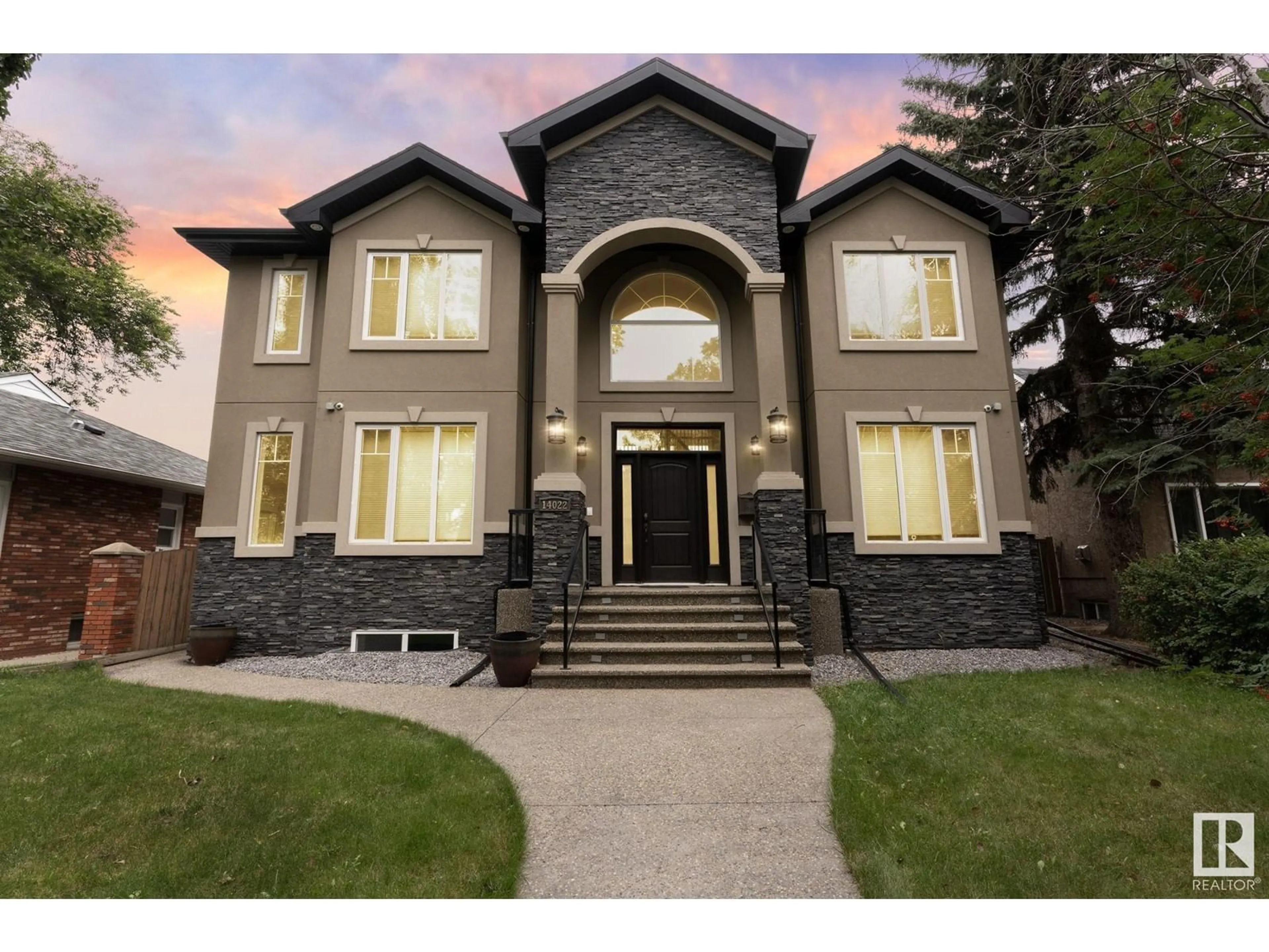 Home with brick exterior material, street for 14022 105 AV NW, Edmonton Alberta T5N0Y9