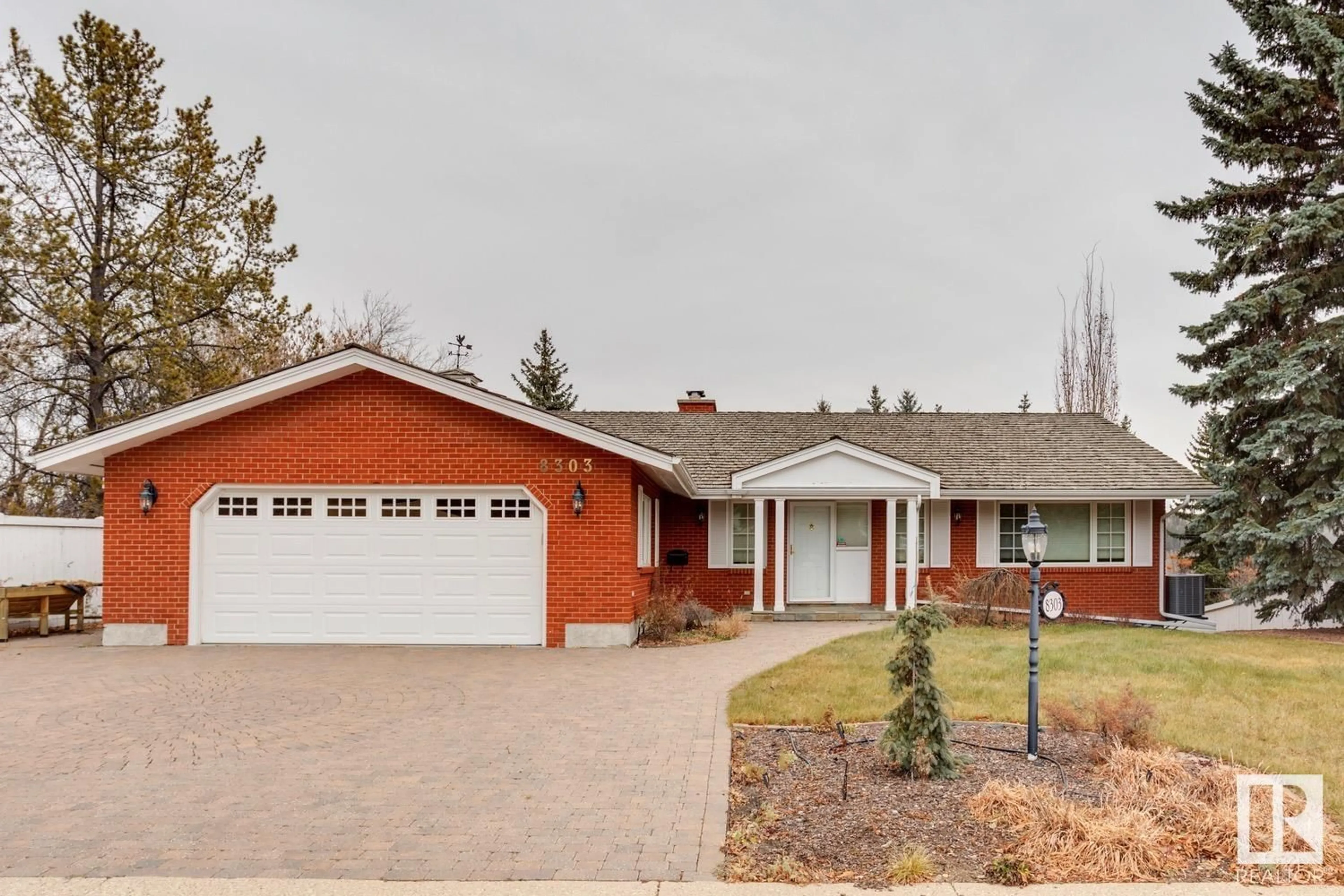 Home with brick exterior material, street for 8303 134 ST NW, Edmonton Alberta T5R0B2