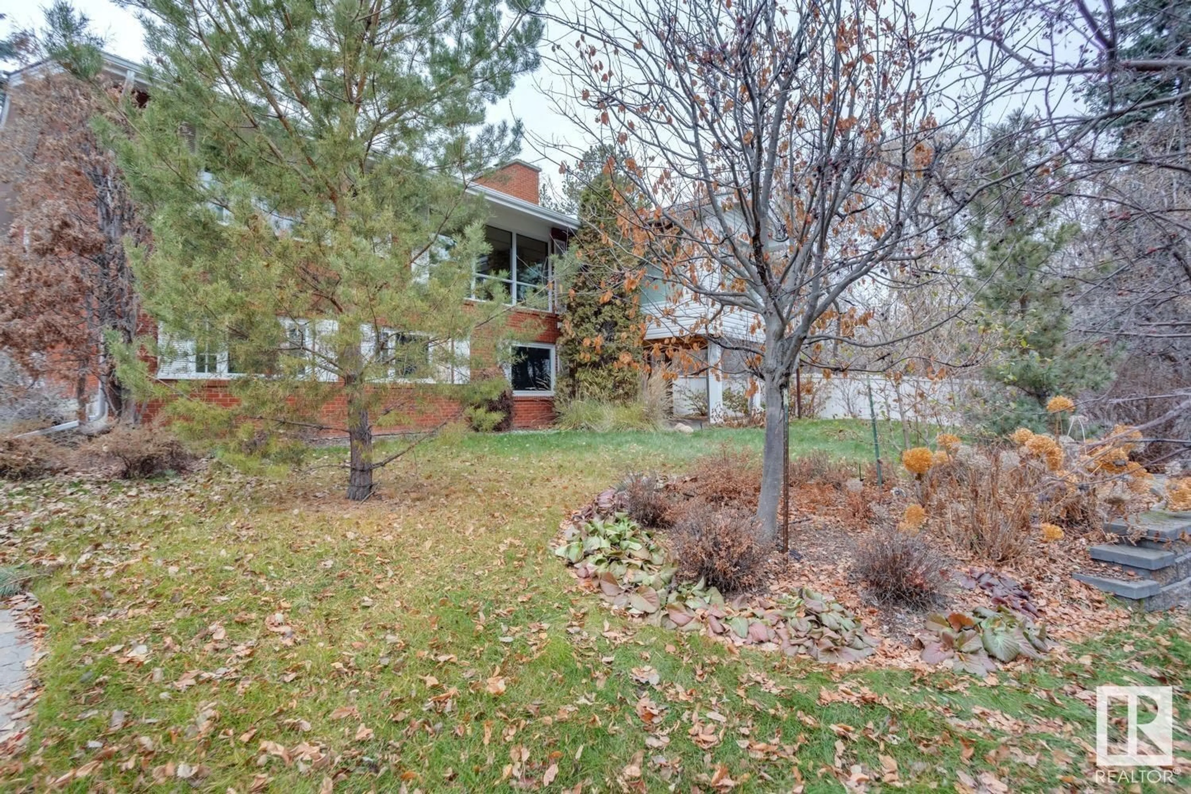 A pic from outside/outdoor area/front of a property/back of a property/a pic from drone, street for 8303 134 ST NW, Edmonton Alberta T5R0B2