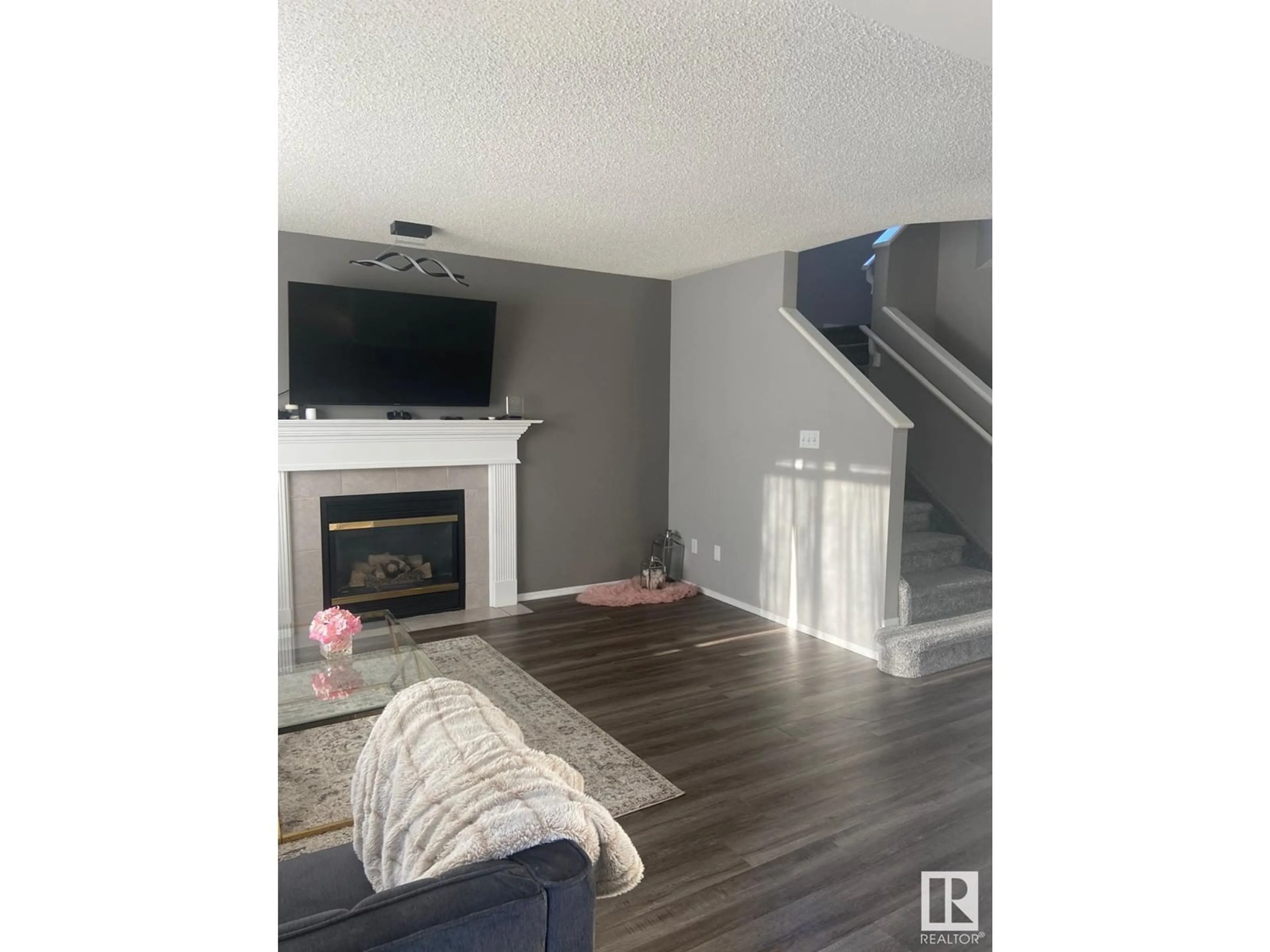 Living room with furniture, wood/laminate floor for 127 WARD CR NW, Edmonton Alberta T6T1M6