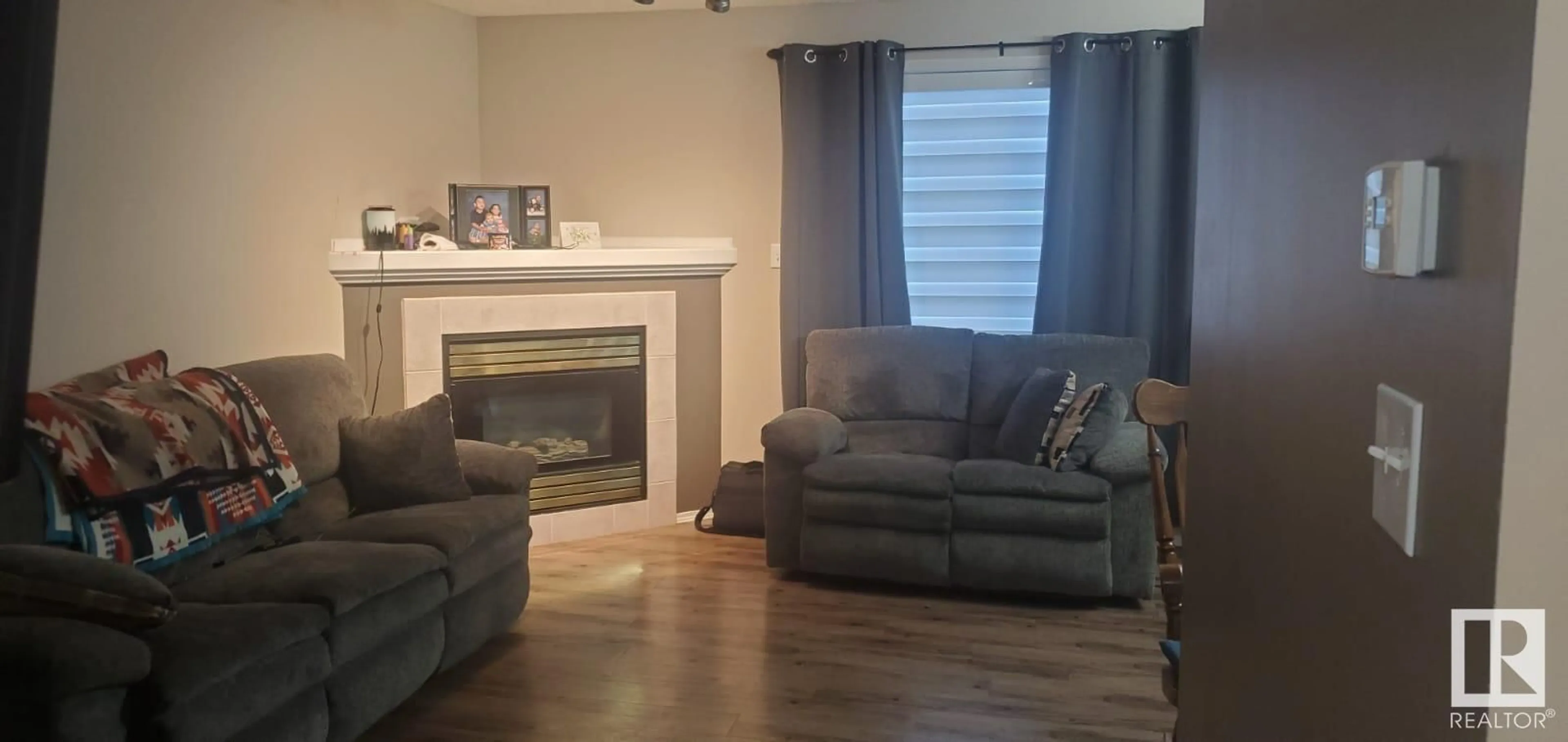 Living room with furniture, wood/laminate floor for #43 300 HOOPER CR NW, Edmonton Alberta T5A5B3