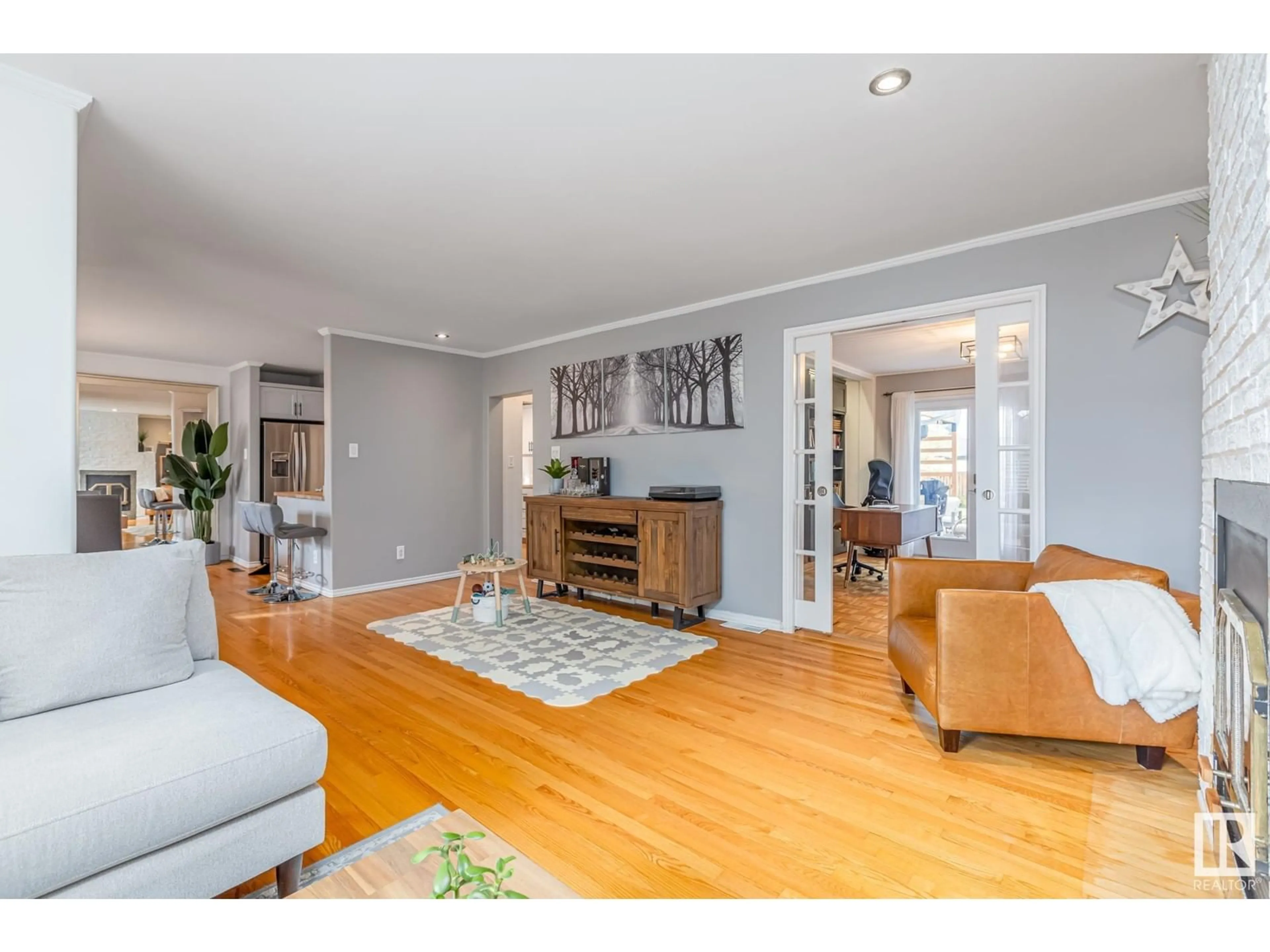 Living room with furniture, wood/laminate floor for 14010 104A AV NW, Edmonton Alberta T5N0X9