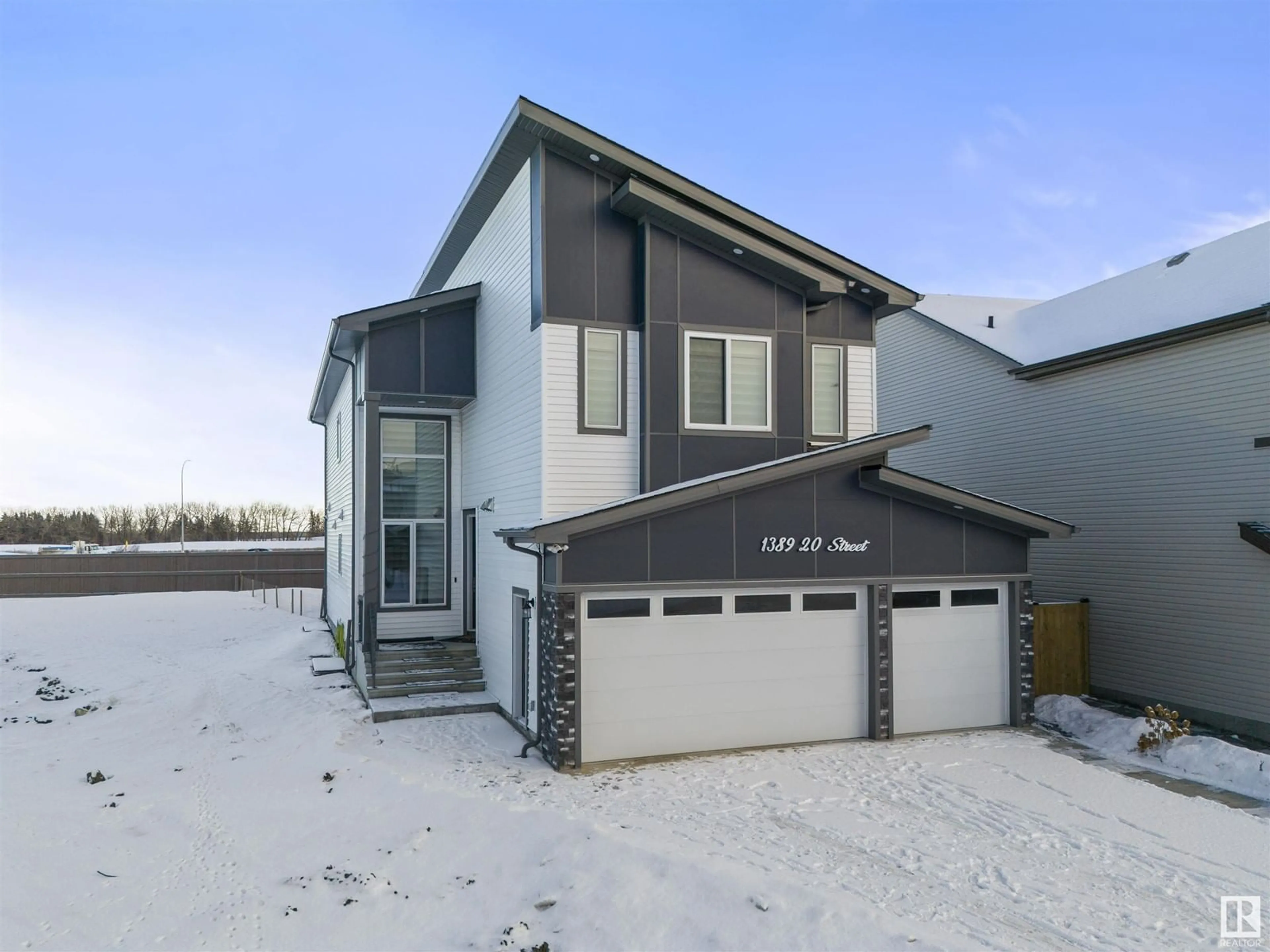 Home with vinyl exterior material, street for 1389 20 ST NW, Edmonton Alberta T6T2M7