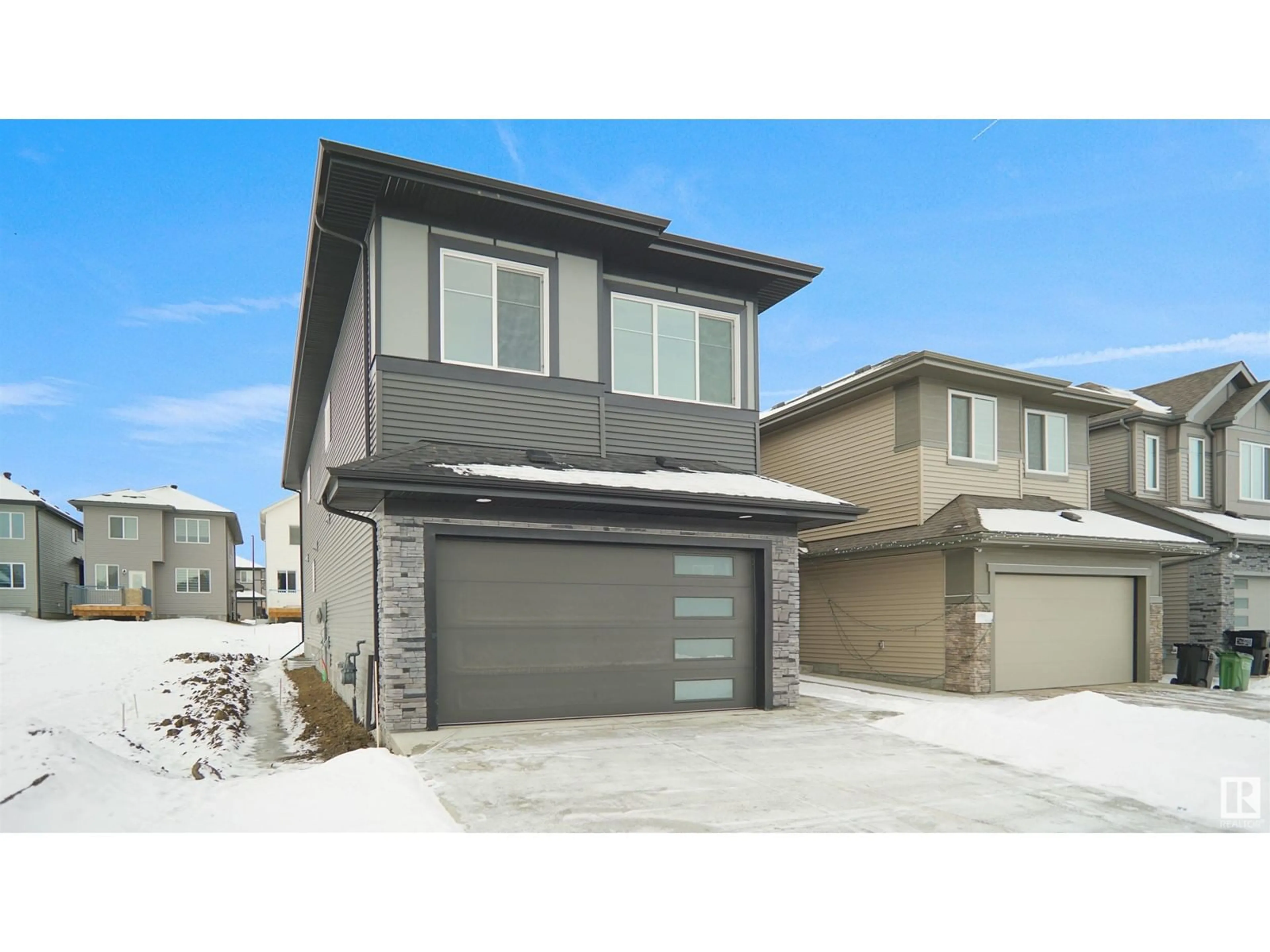 Home with vinyl exterior material, street for 16904 47 ST NW, Edmonton Alberta T5Y0W3