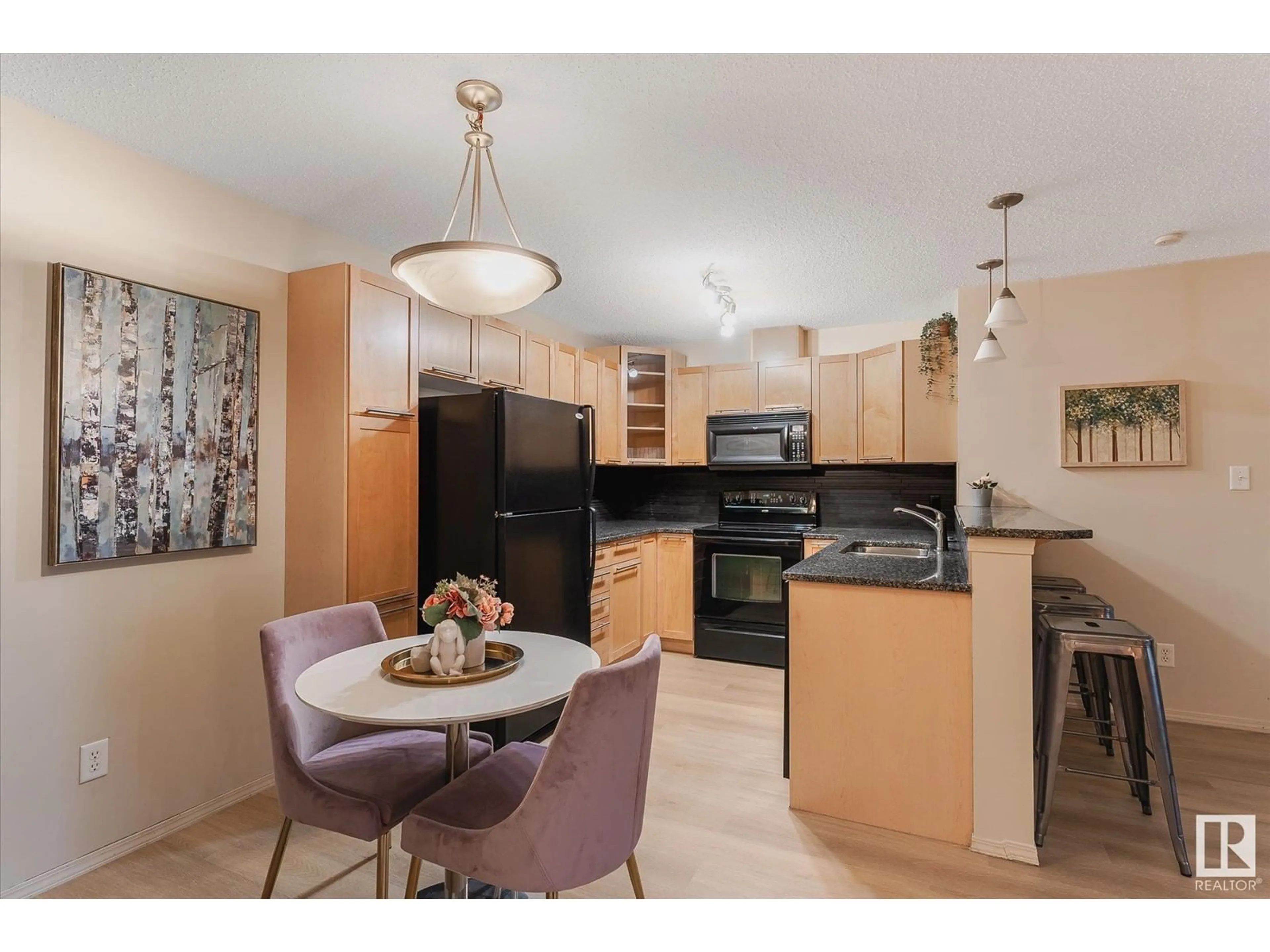 Open concept kitchen, unknown for #336 2436 GUARDIAN RD NW, Edmonton Alberta T5T2P5