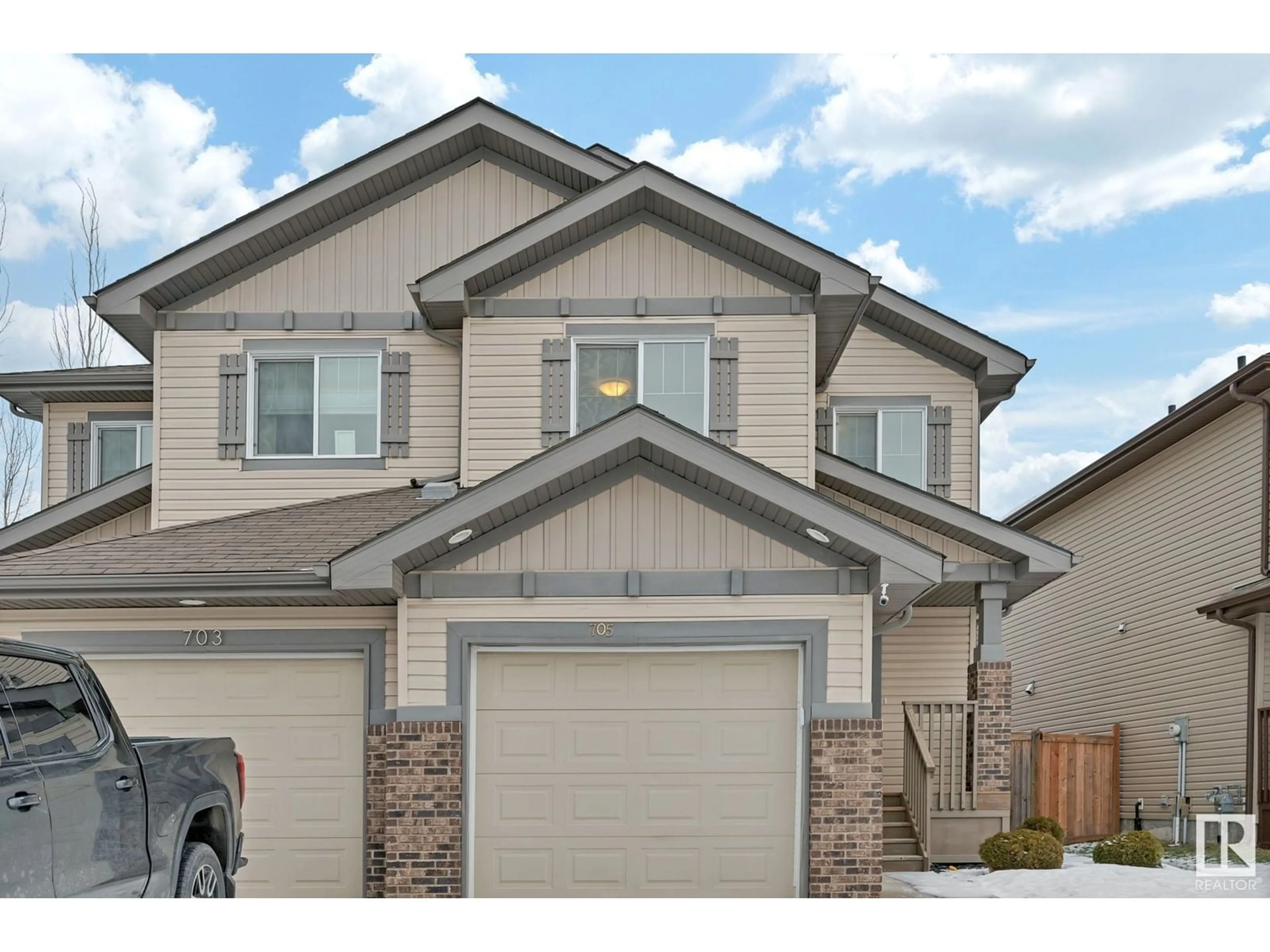 Home with vinyl exterior material, street for 705 176 ST SW, Edmonton Alberta T6W0S2