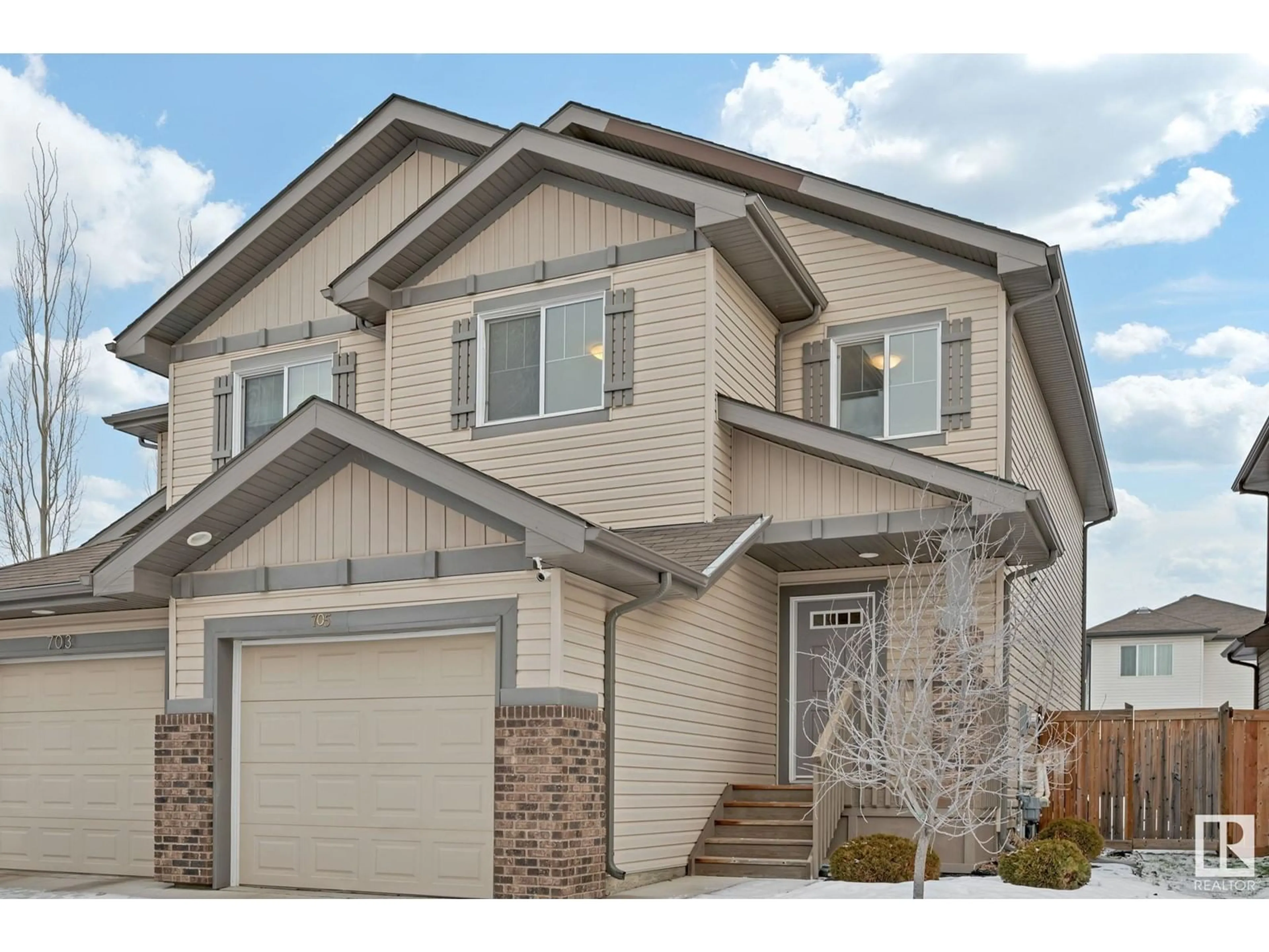 Home with vinyl exterior material, street for 705 176 ST SW, Edmonton Alberta T6W0S2