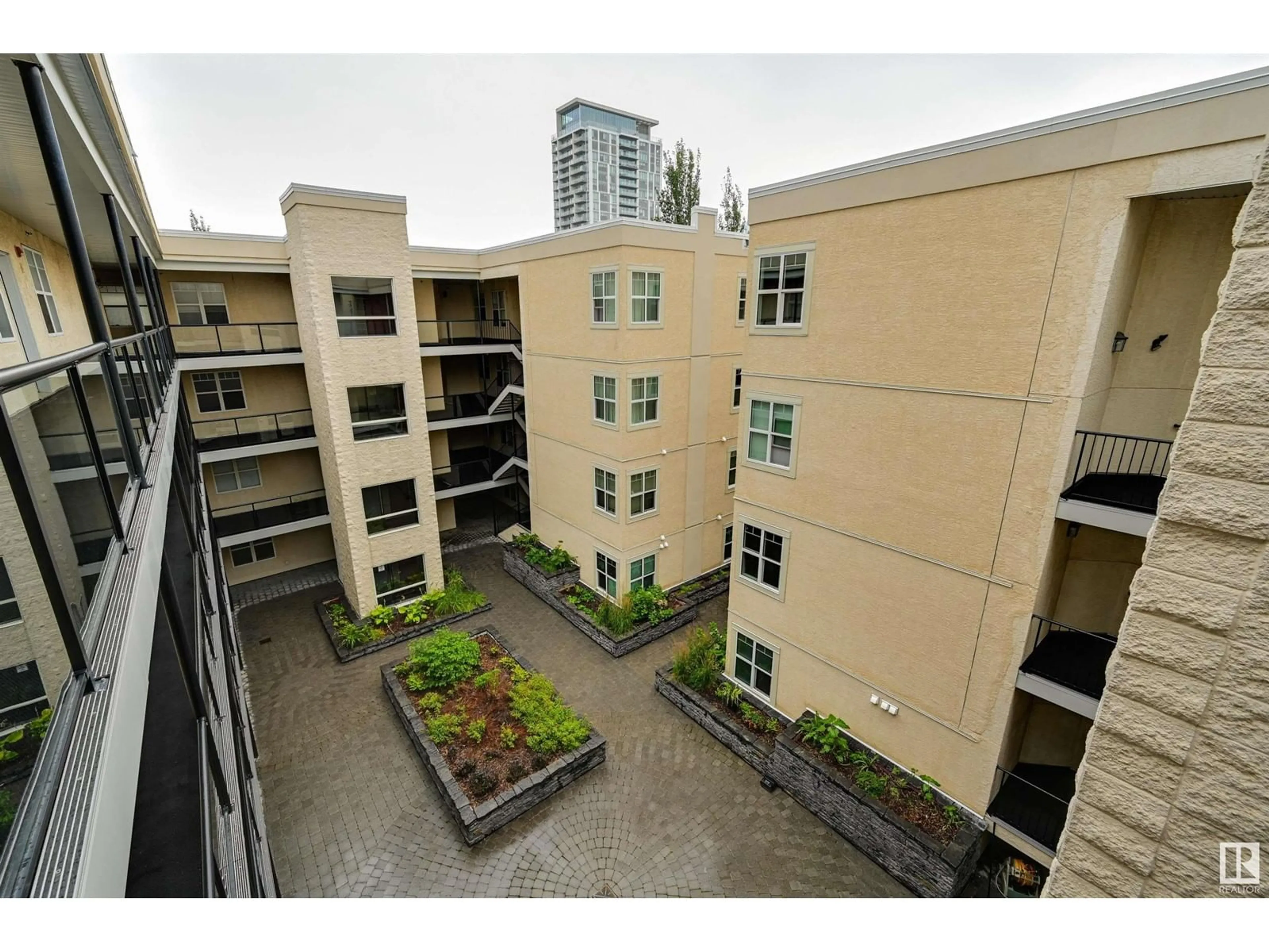 Patio, city buildings view from balcony for #404 9828 112 ST NW, Edmonton Alberta T5K1L4