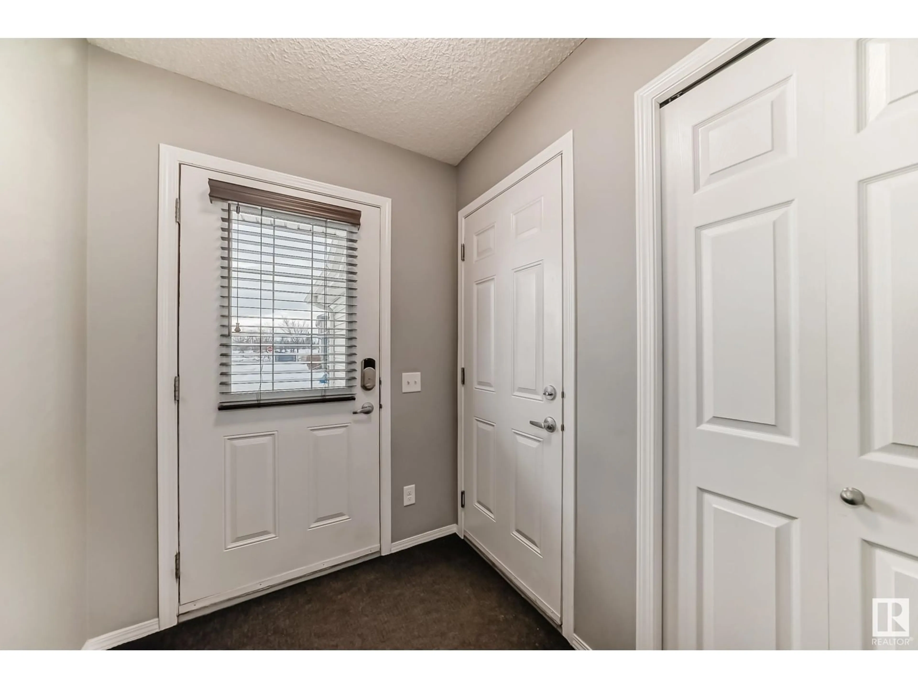 Indoor entryway for #33 6520 2 AV SW, Edmonton Alberta T6X1S4