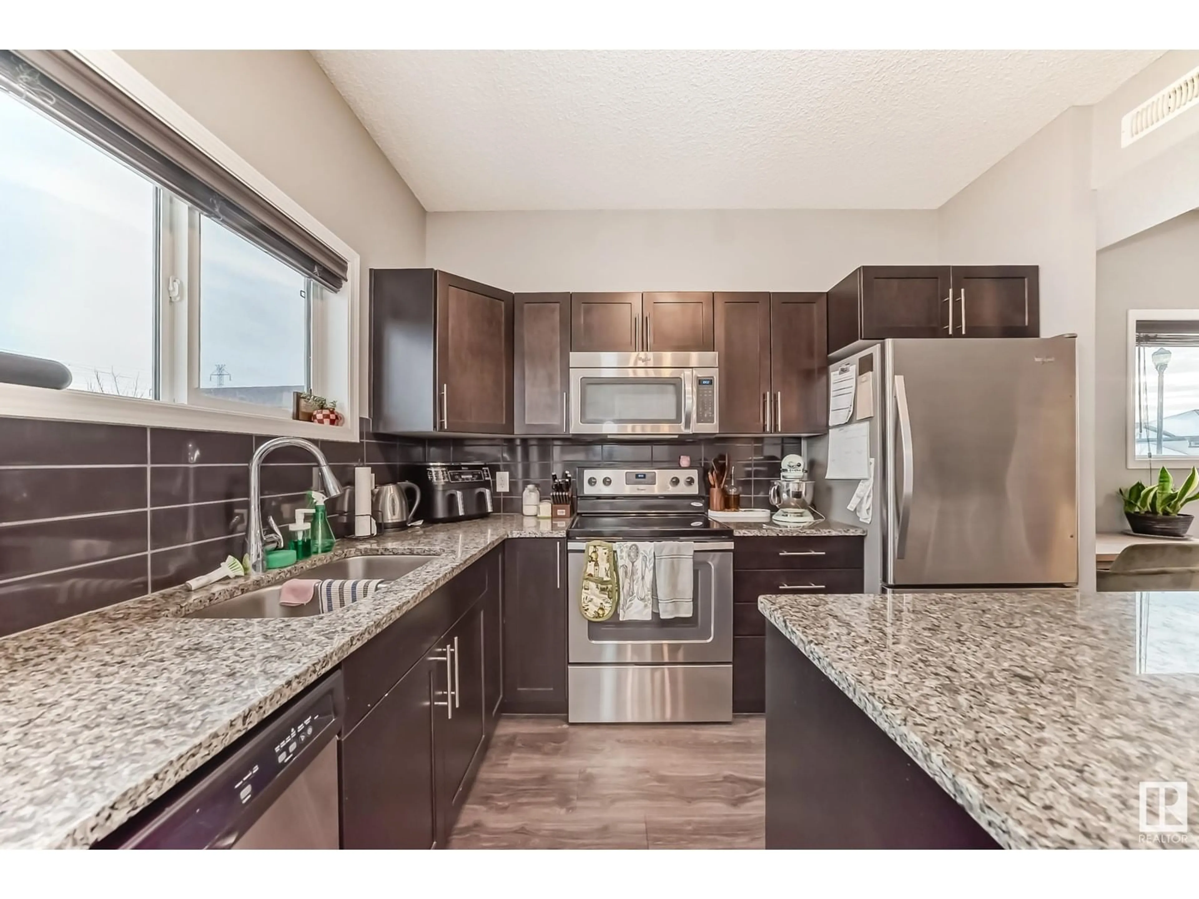 Open concept kitchen, unknown for #33 6520 2 AV SW, Edmonton Alberta T6X1S4