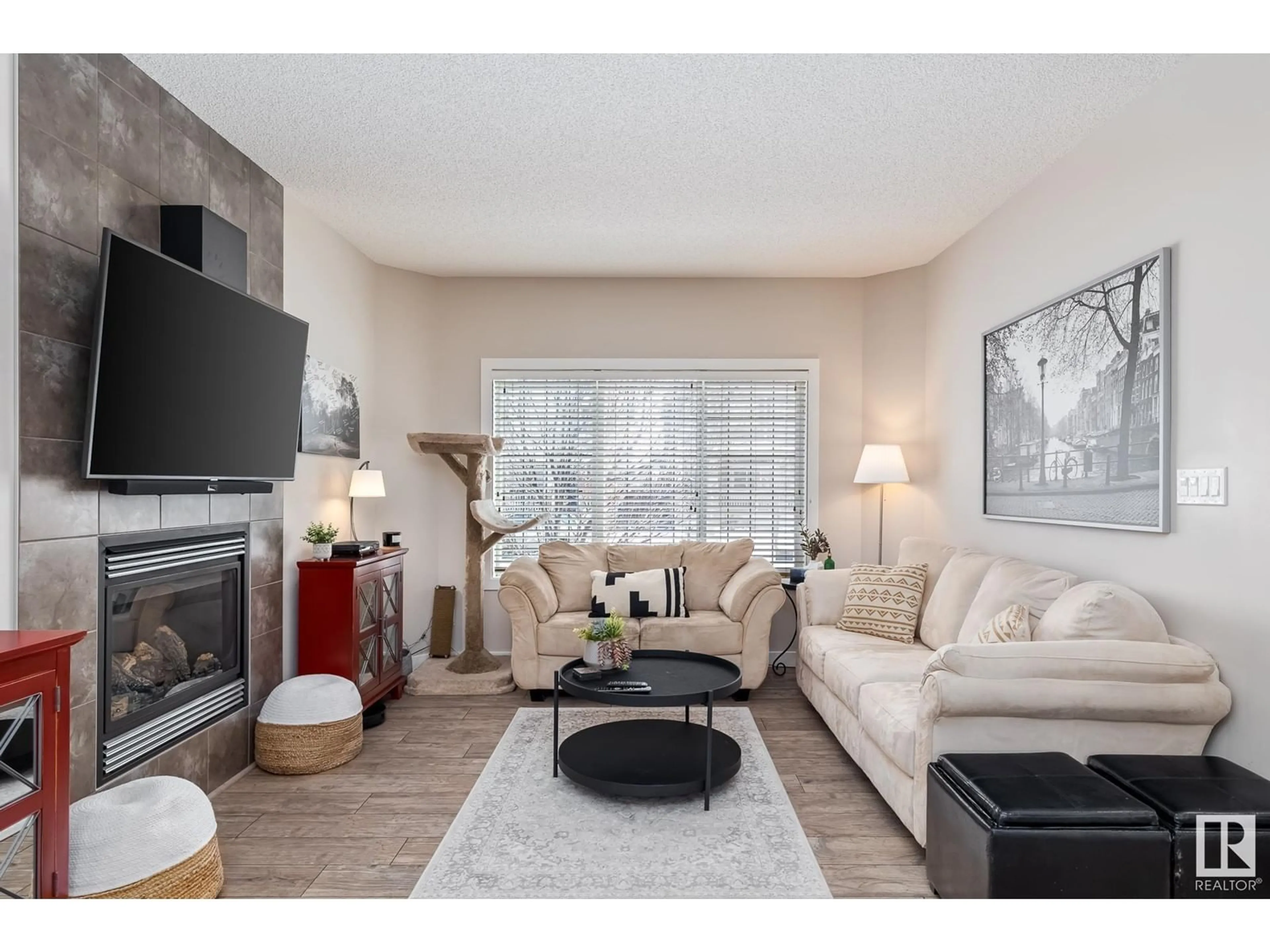 Living room with furniture, wood/laminate floor for 8120 224 ST NW, Edmonton Alberta T5T7A4