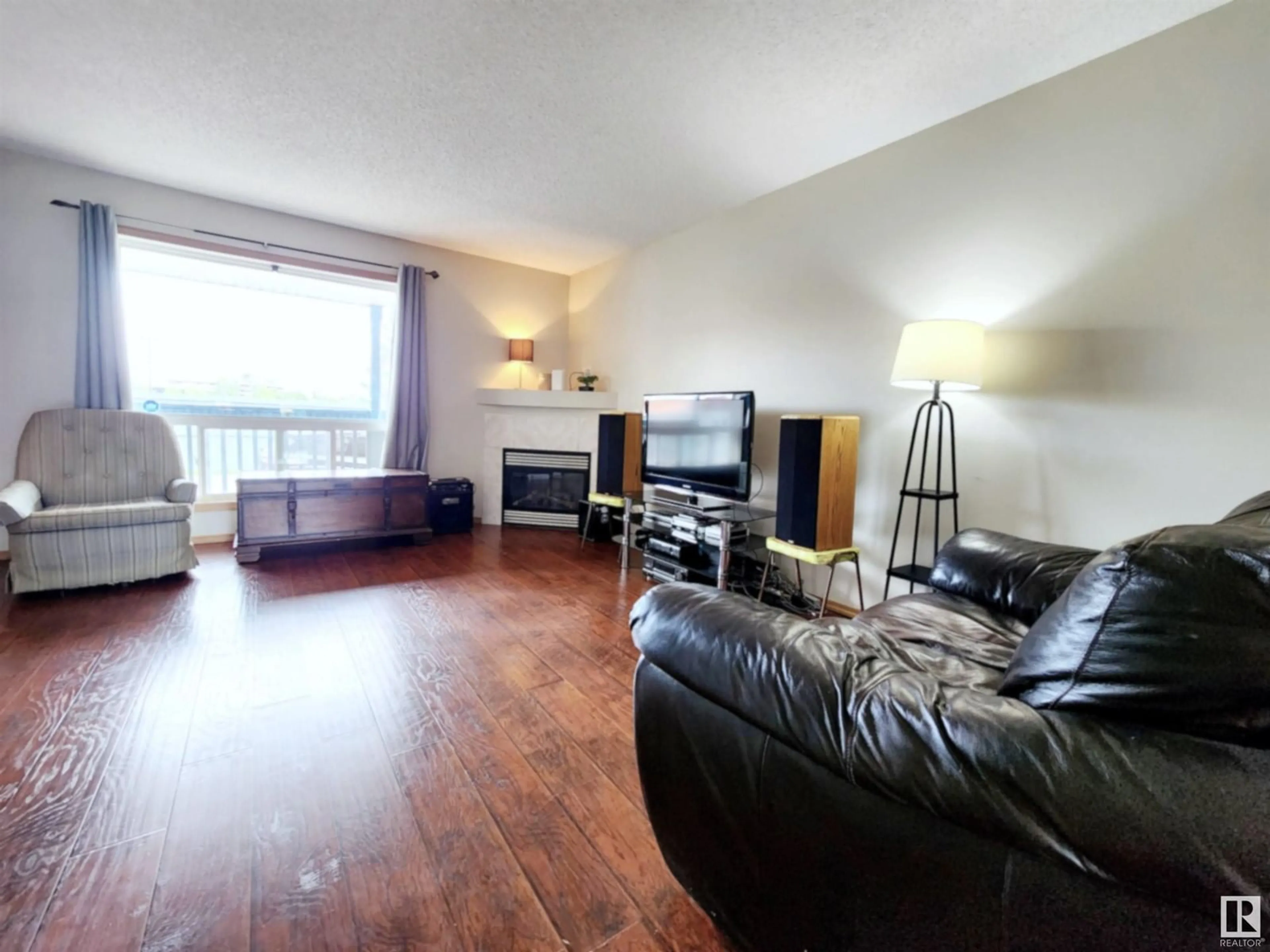 Living room with furniture, wood/laminate floor for #71 10909 106 ST NW, Edmonton Alberta T5H4M7