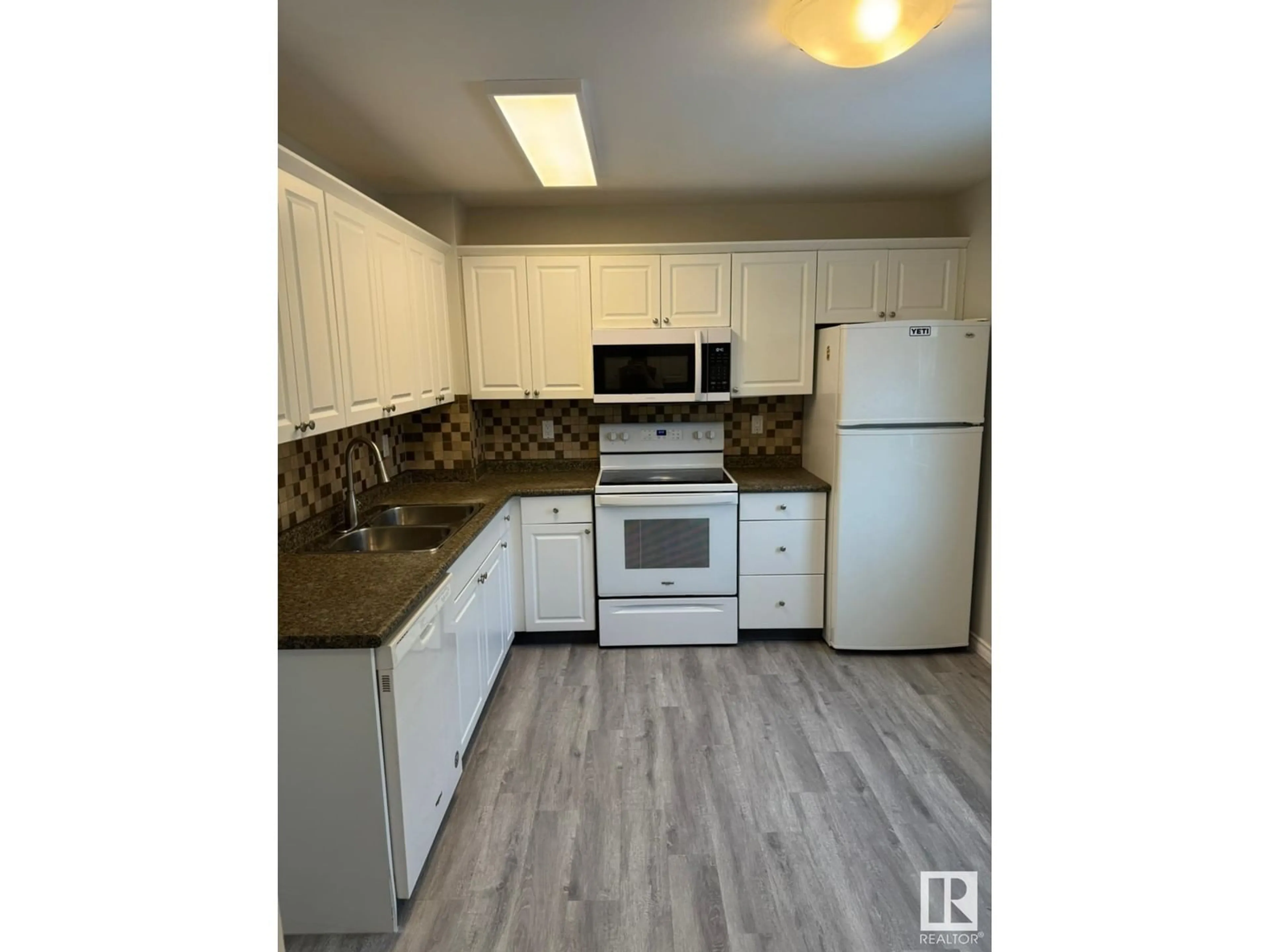 Standard kitchen, wood/laminate floor for #50 14511 52 ST NW, Edmonton Alberta T5A4M6