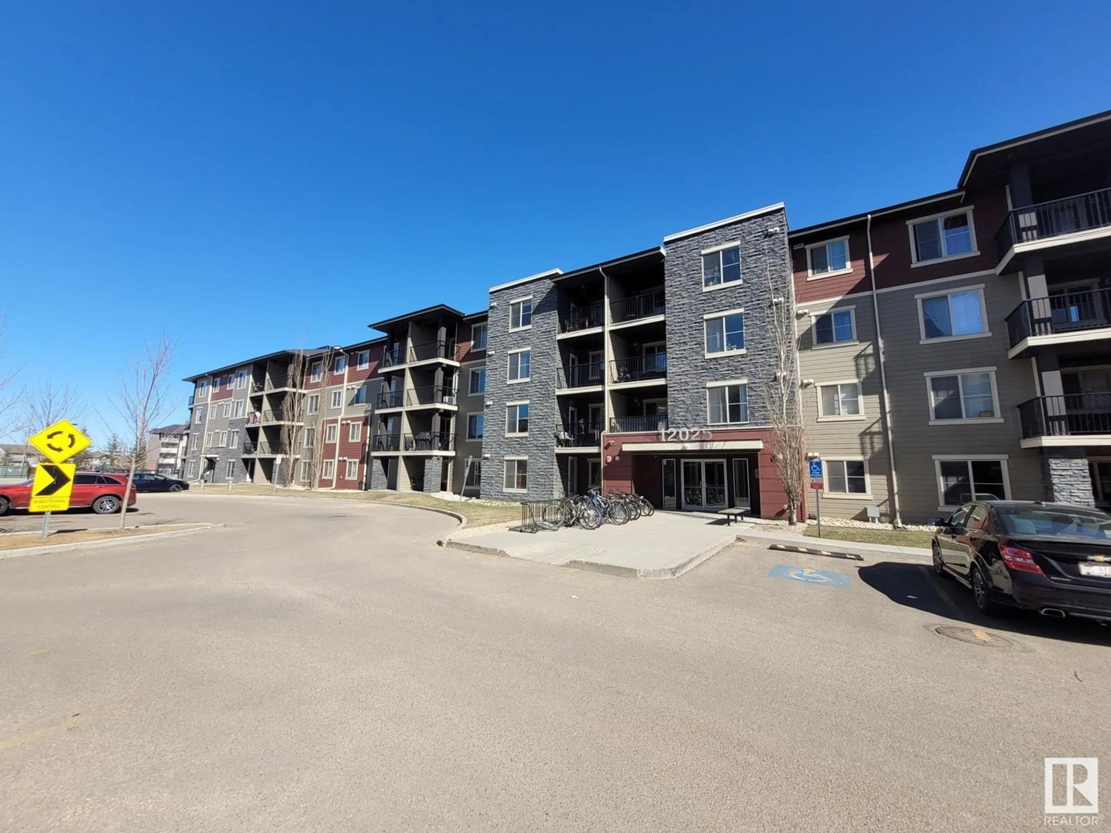 A pic from outside/outdoor area/front of a property/back of a property/a pic from drone, building for #407 12025 22 AV SW, Edmonton Alberta T6W2Y1