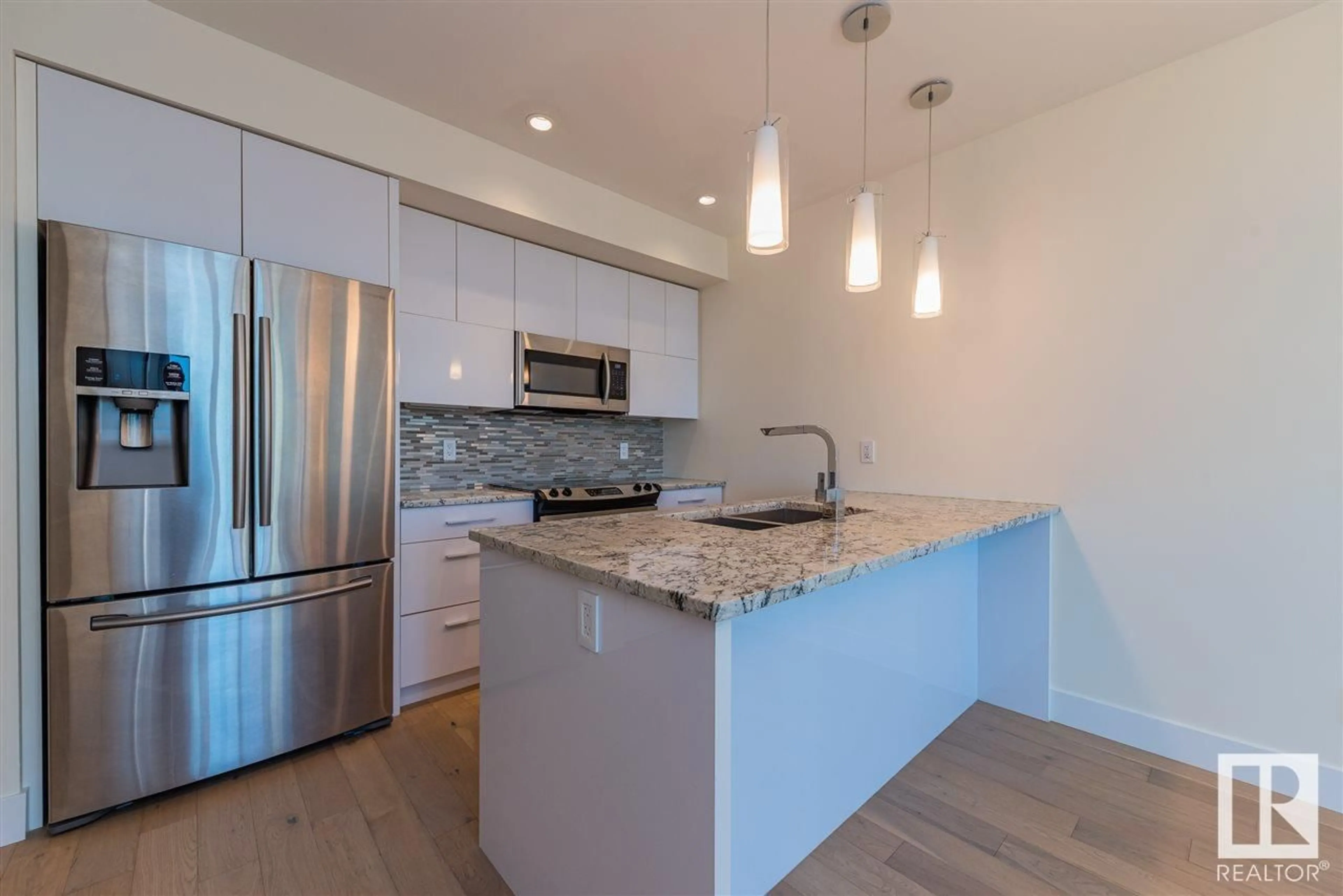 Open concept kitchen, unknown for #401 11969 JASPER AV NW, Edmonton Alberta T5K0P1