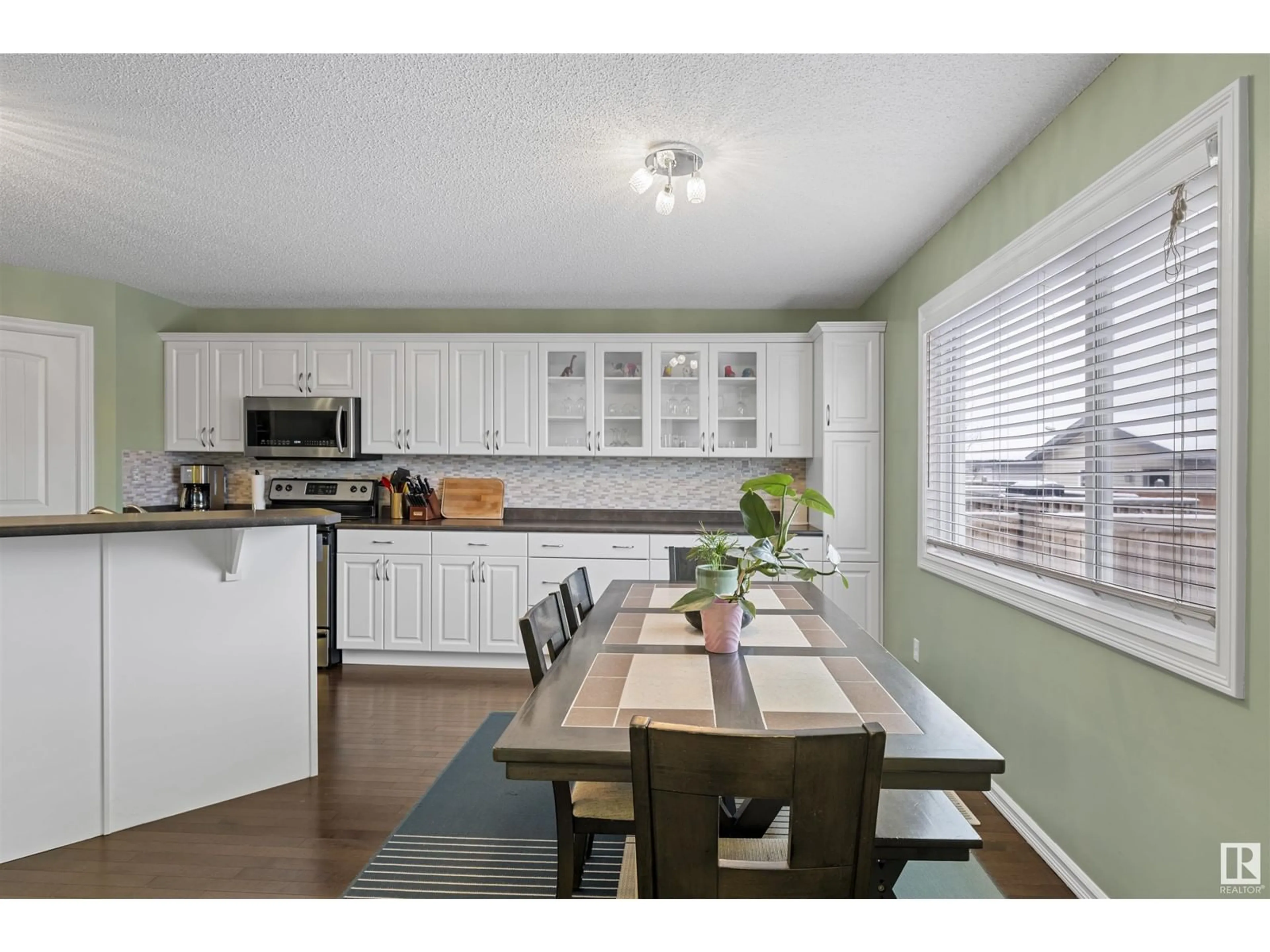 Open concept kitchen, wood/laminate floor for 1134 35A AV NW, Edmonton Alberta T6T0J7