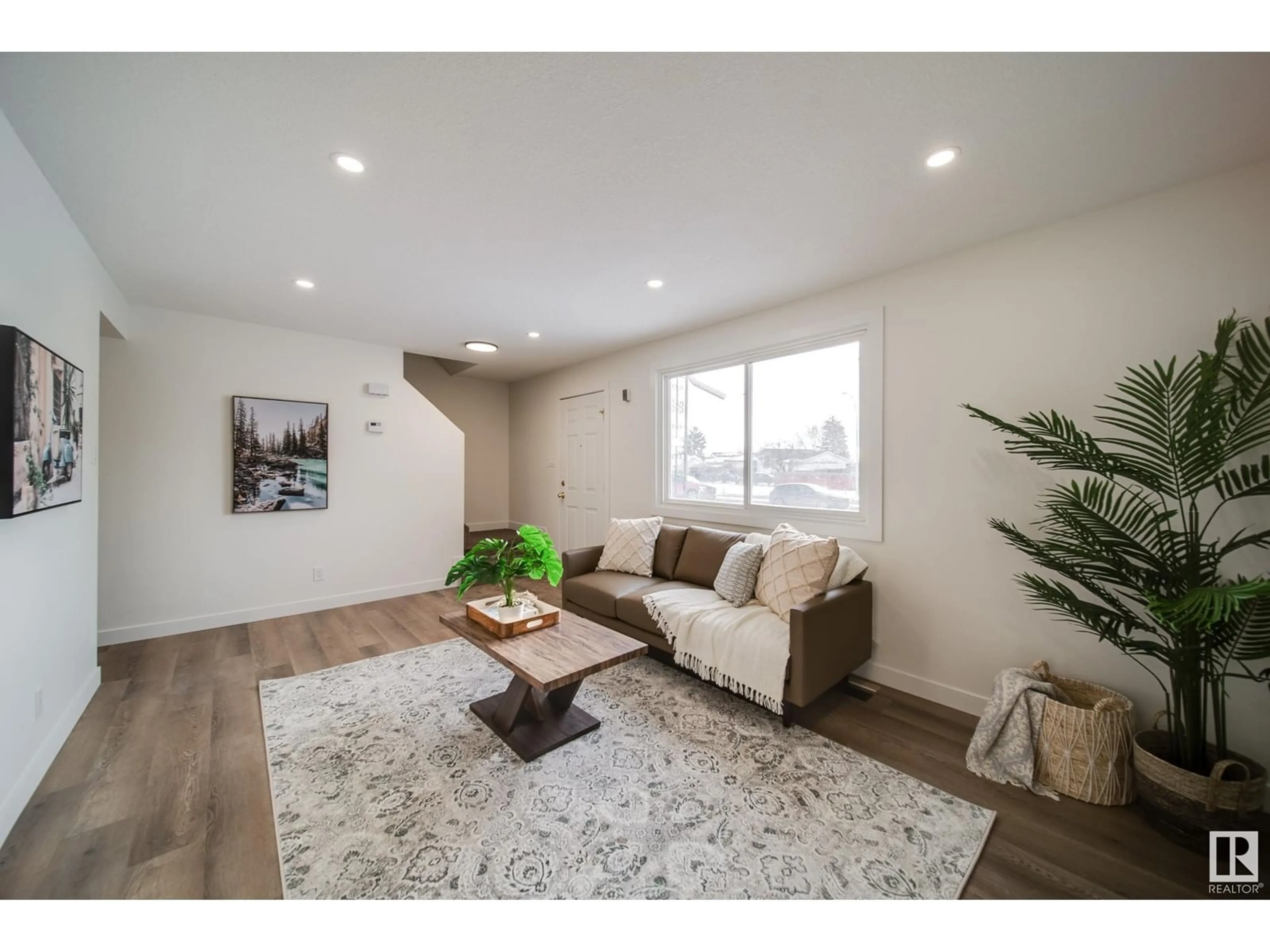 Living room with furniture, wood/laminate floor for 436 HERMITAGE RD NW, Edmonton Alberta T5A3L1