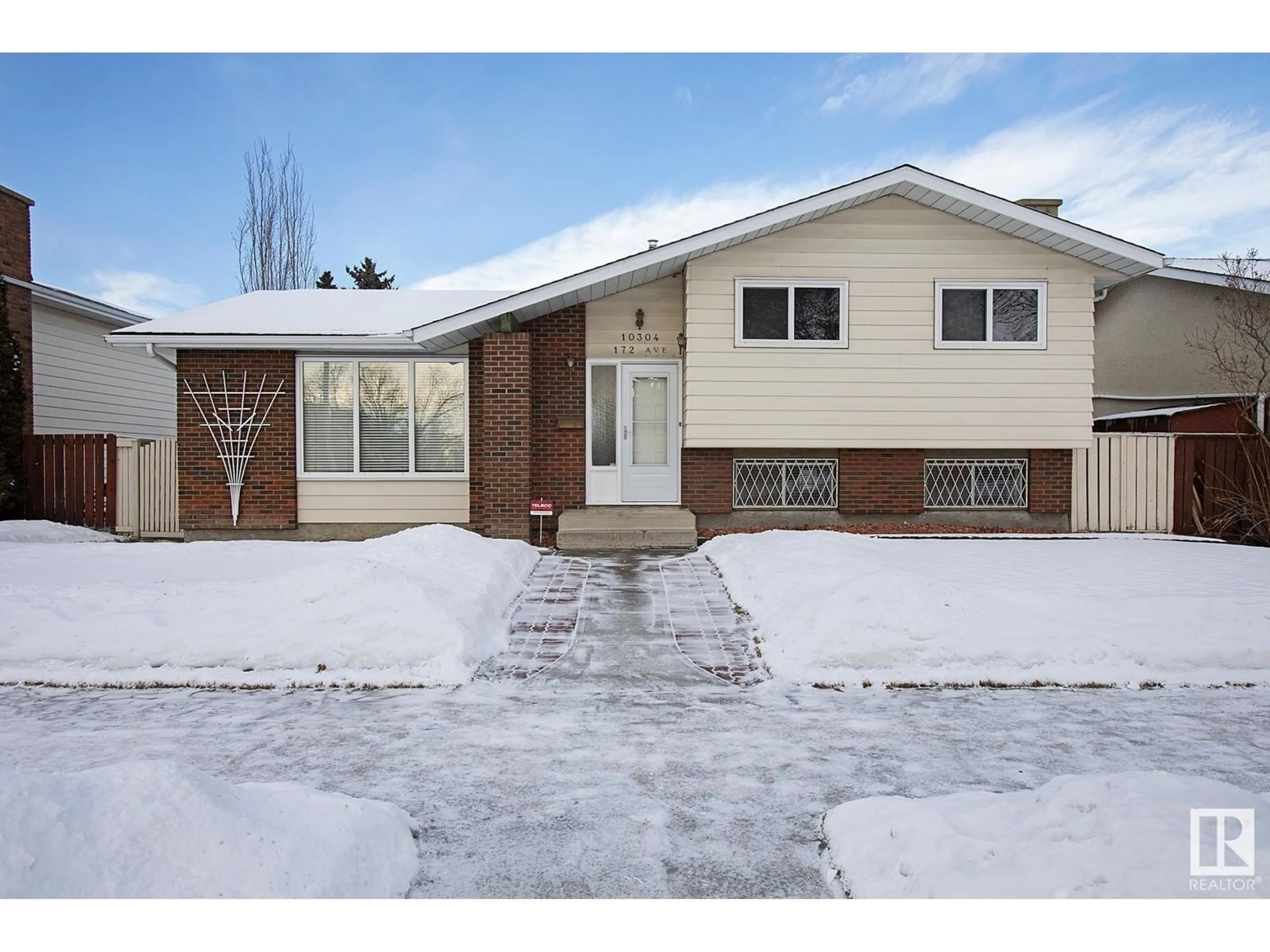 Home with brick exterior material, street for 10304 172 AV NW, Edmonton Alberta T5X3X6