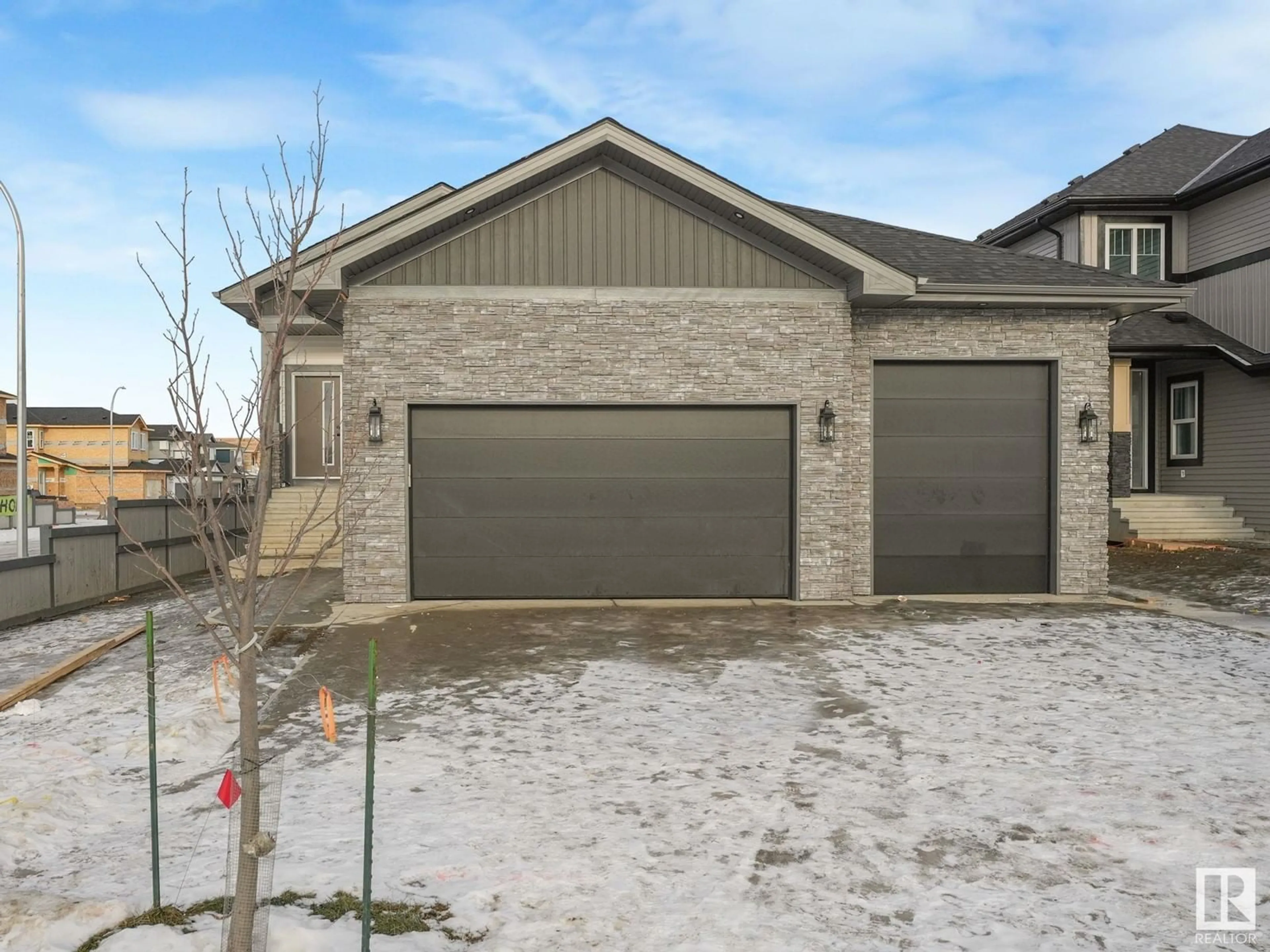 Home with brick exterior material, street for 30 Avonlea Way, Spruce Grove Alberta T7X0Y3