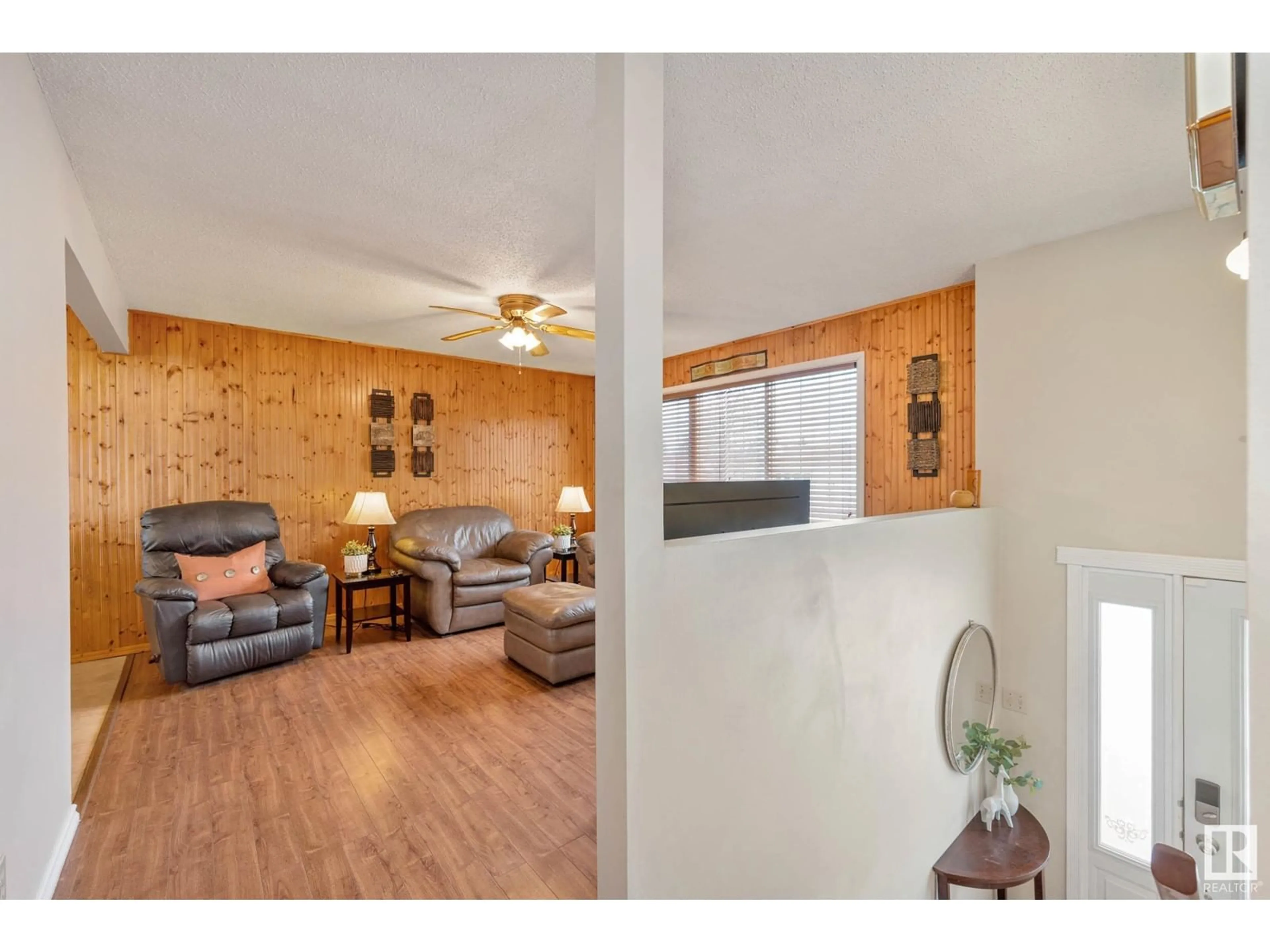 Living room with furniture, wood/laminate floor for 43 Garden Valley DR, Stony Plain Alberta T7Z1H5