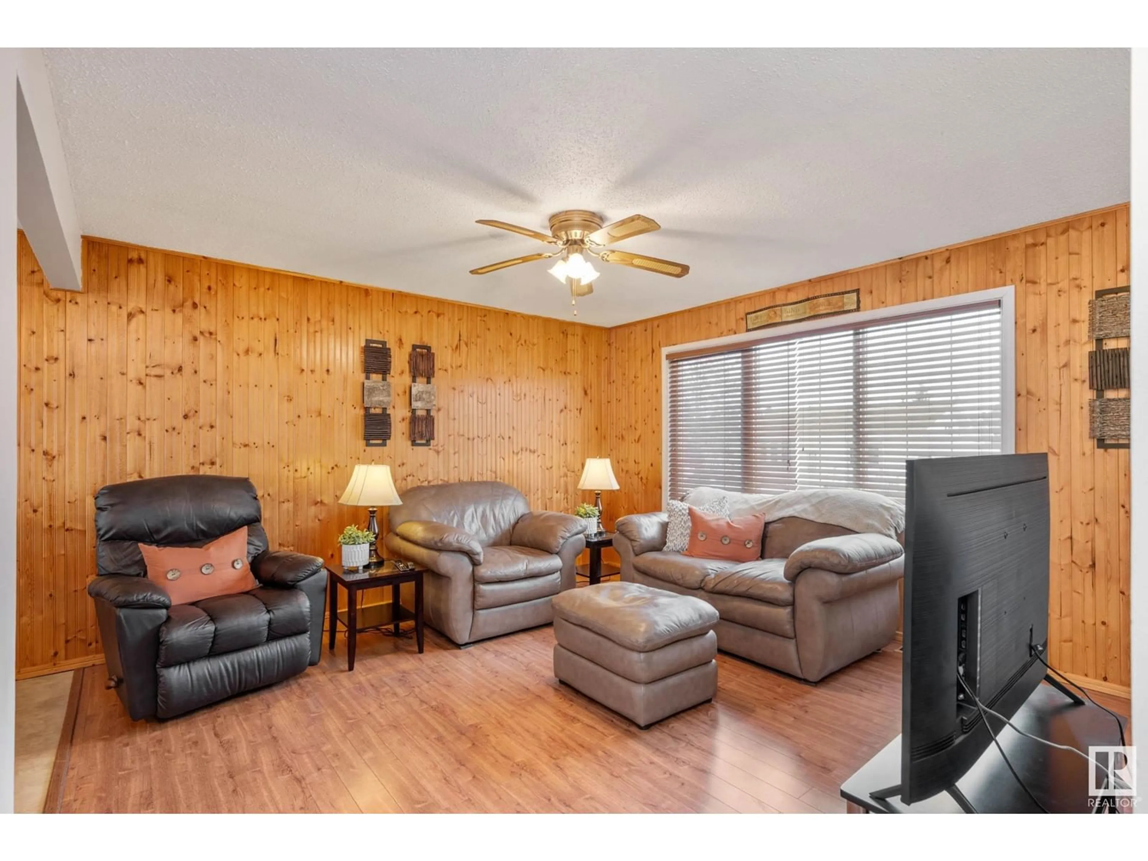 Living room with furniture, wood/laminate floor for 43 Garden Valley DR, Stony Plain Alberta T7Z1H5