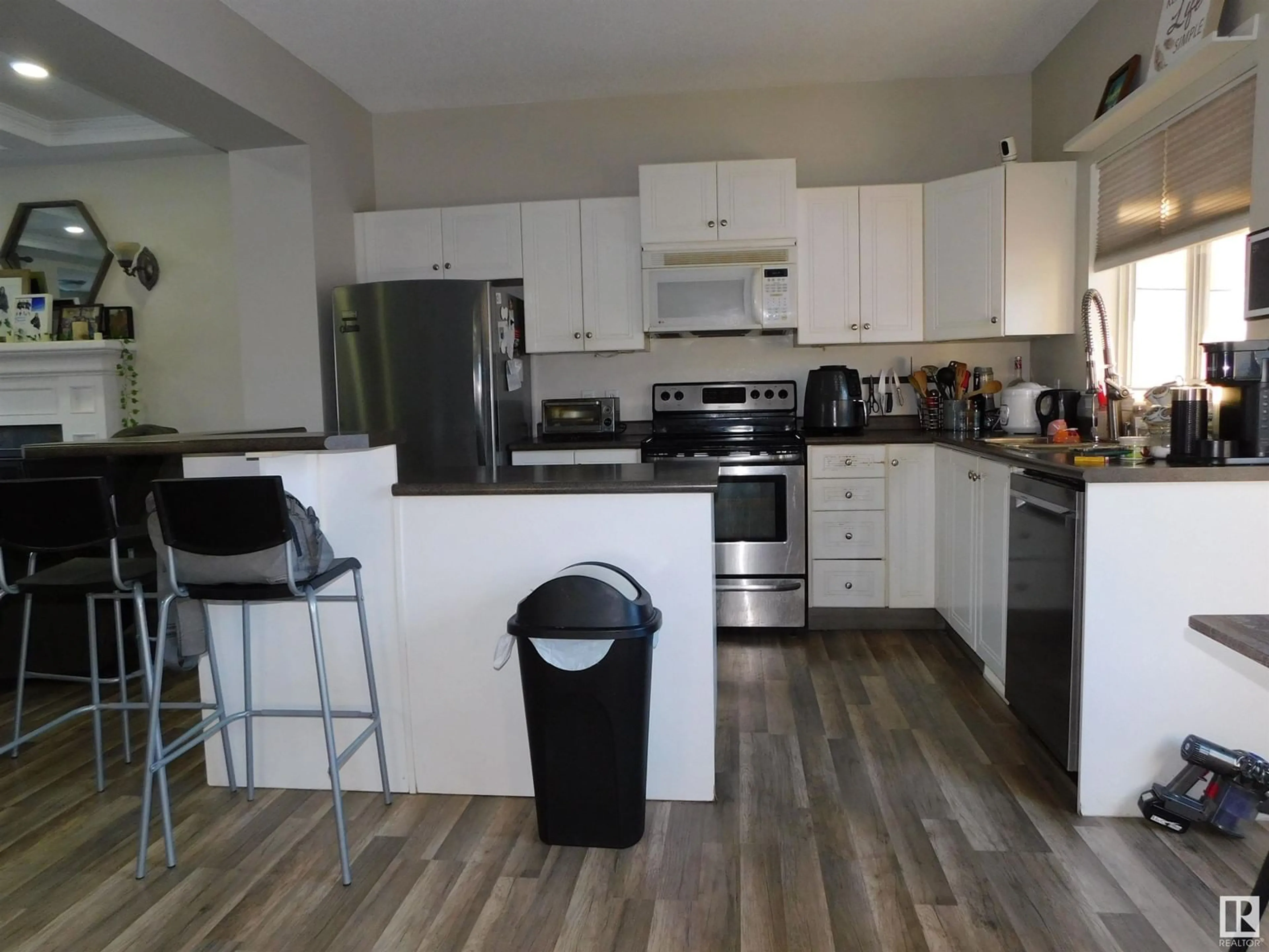 Open concept kitchen, wood/laminate floor for 15012 136 ST NW, Edmonton Alberta T6V1N2