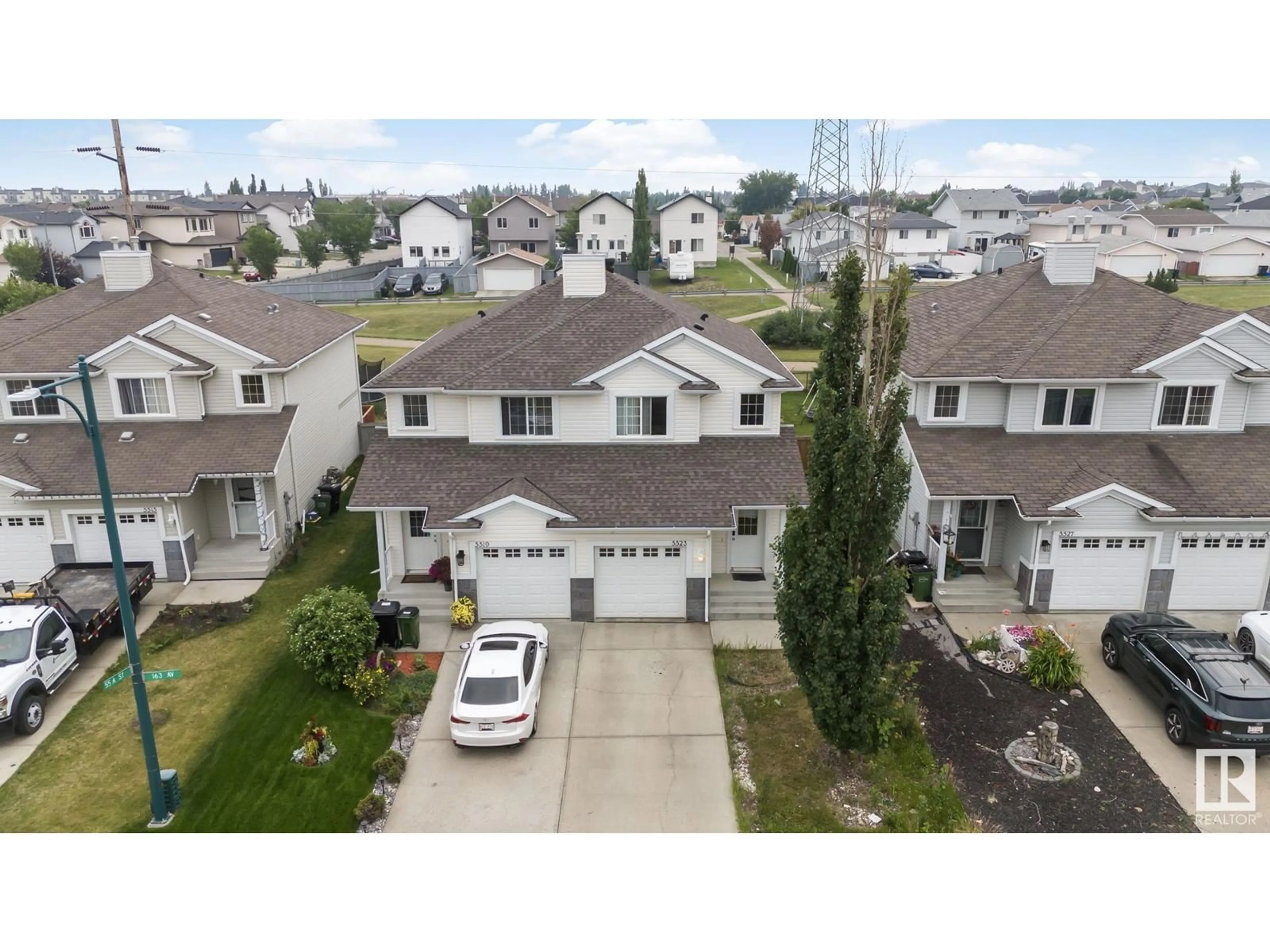 A pic from outside/outdoor area/front of a property/back of a property/a pic from drone, street for 5523 163 AV NW, Edmonton Alberta T5Y3L2